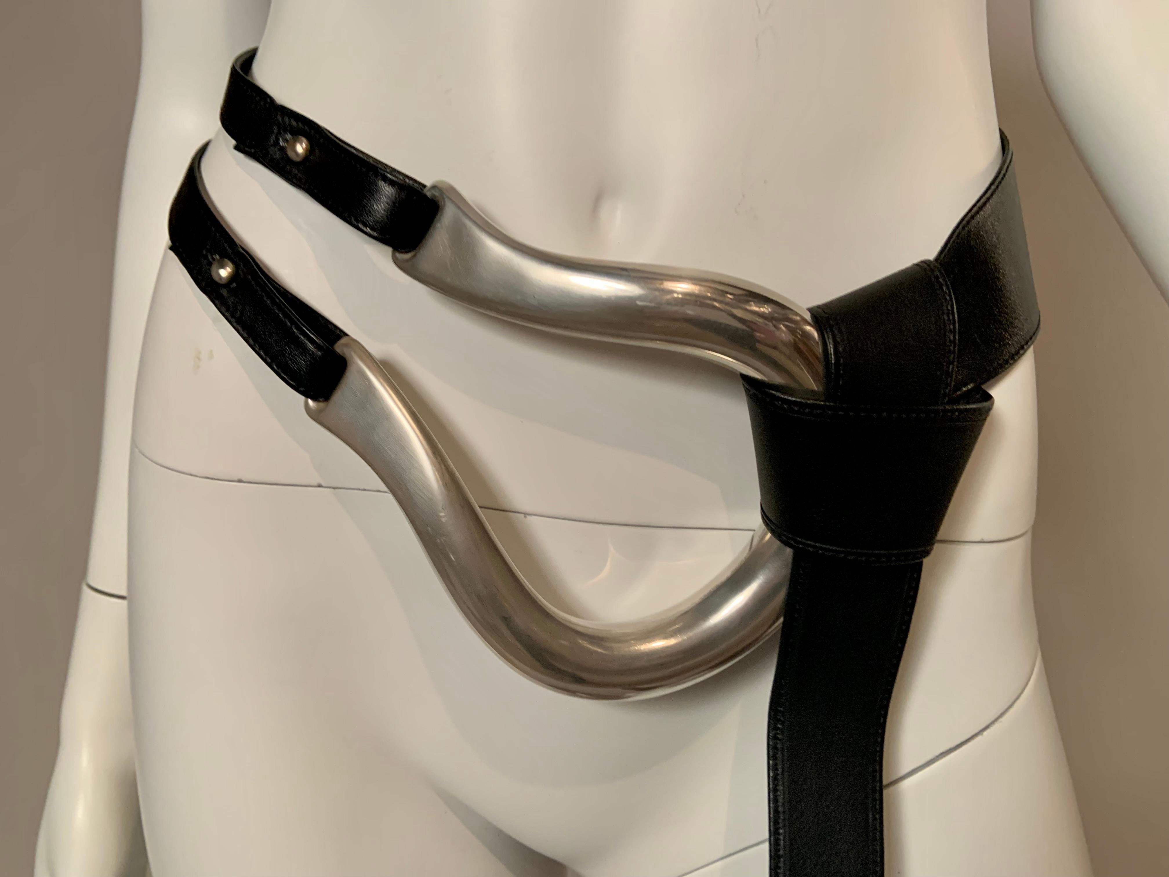 The largest of the the three sizes,  this iconic sterling silver horseshoe buckle and black leather belt was designed by Elsa Peretti for Halston and retailed by Tiffany & Co. The buttons are both marked Peretti and Tiffany & Co. and the buckle is
