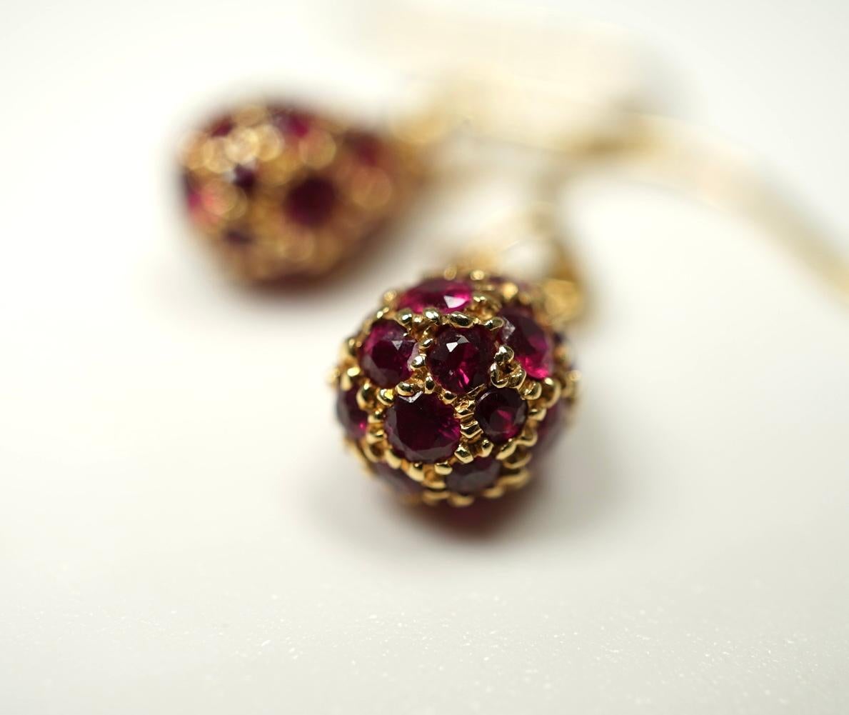 In 18 karat yellow gold by Elsa Peretti for Tiffany, these beautiful teardrop shaped pave ruby earrings are stunning!
