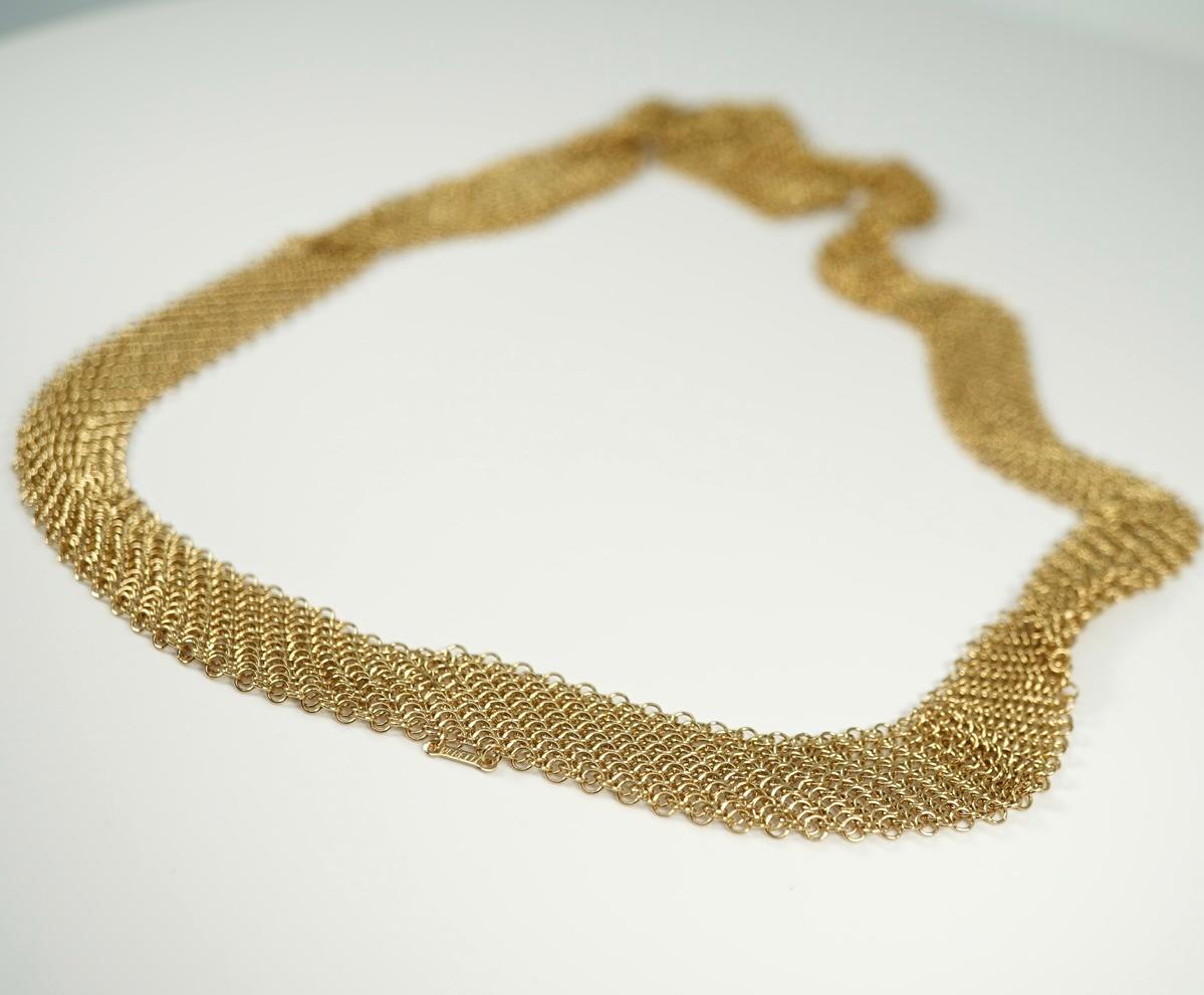 From the famed designer Elsa Peretti, this beautiful 18 karat yellow gold mesh necklace was created for Tiffany & Co.  First shown in the mid 1970's - this design is timeless! 
In Tiffany fold over pouch.