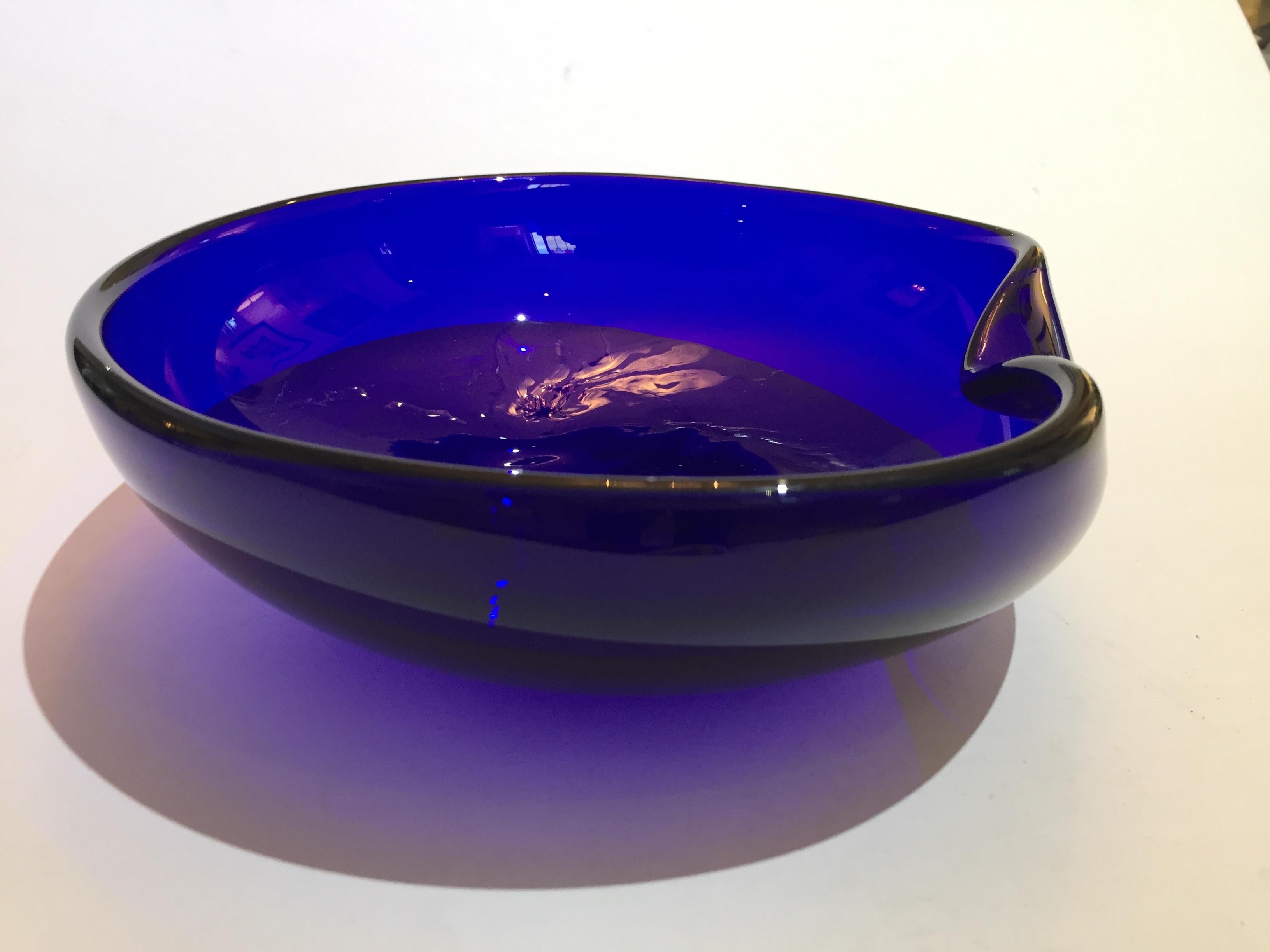 Iconic 1980s thumbprint low bowl in cobalt blue art glass designed by Elsa Peretti for Tiffany and signed on verso 
