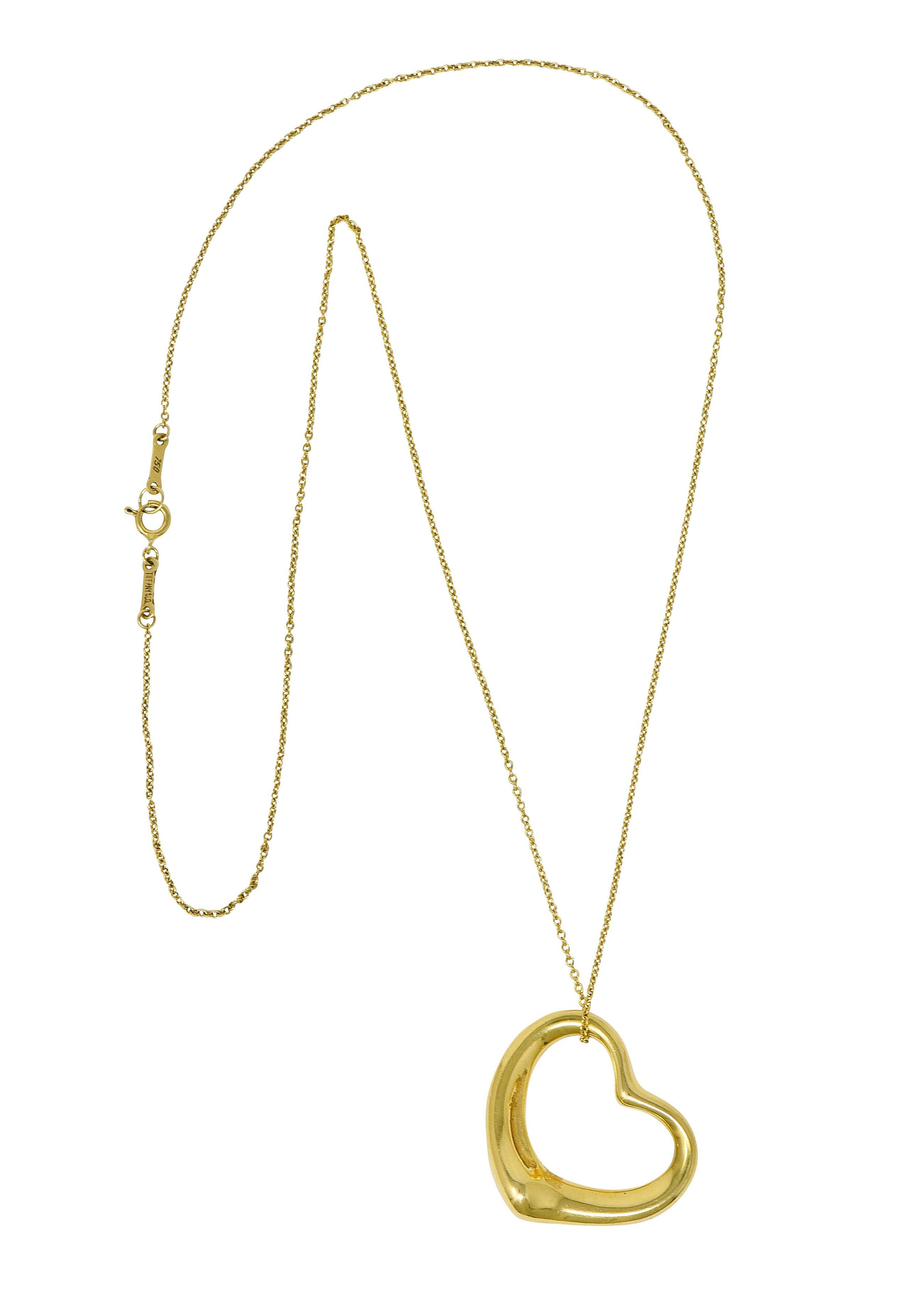 Pendant designed as polished gold open heart motif

Suspending from a classic gold cable chain completed by a spring ring clasp

Both are signed Tiffany & Co. Peretti Spain

Both stamped 750 for 18 karat gold

From the Open Heart collection, circa