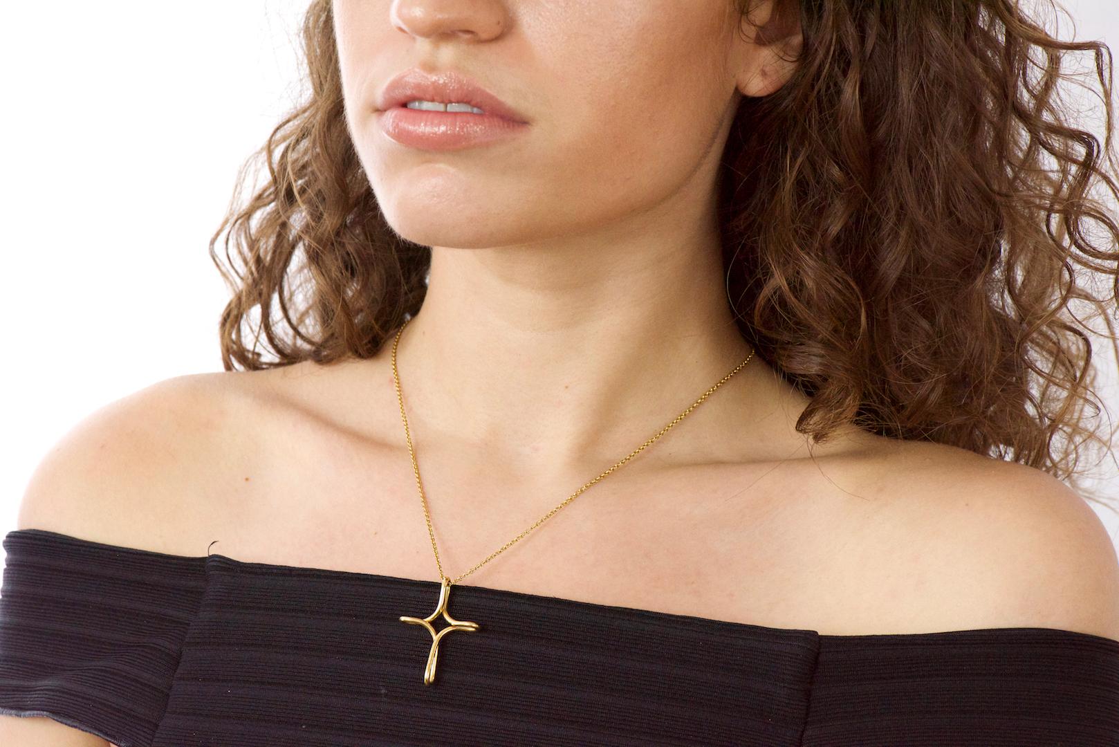 Elsa Peretti Tiffany & Co. 18 Karat Gold Infinity Cross Pendant Necklace In Excellent Condition In Philadelphia, PA