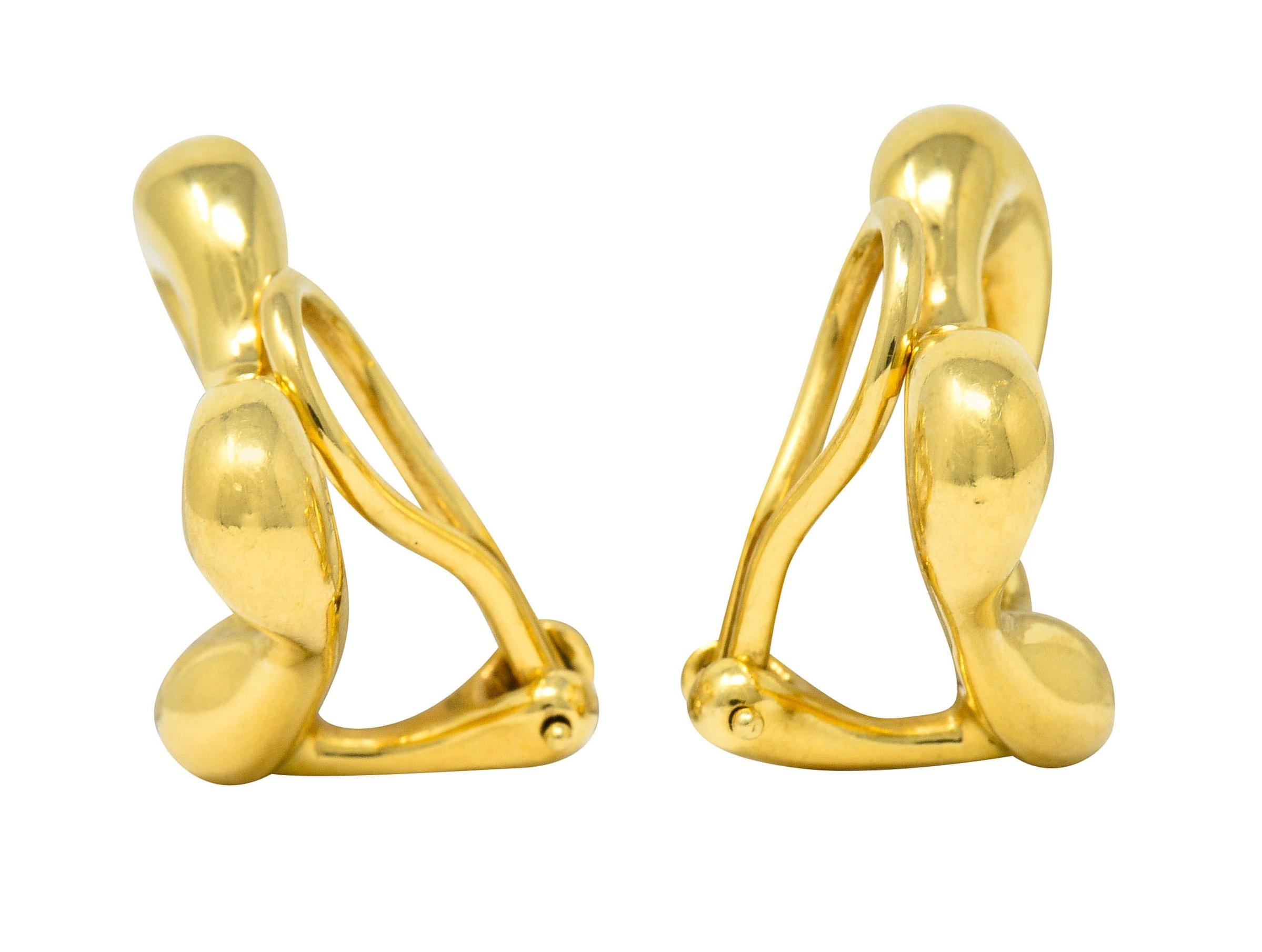 Earrings are designed as the iconic stylized open heart motif

Outline of heart graduates in width and thickness

Completed by hinged omega backs

Stamped 750 for 18 karat gold

Fully signed Elsa Peretti Tiffany & Co.

From the Open Hearts