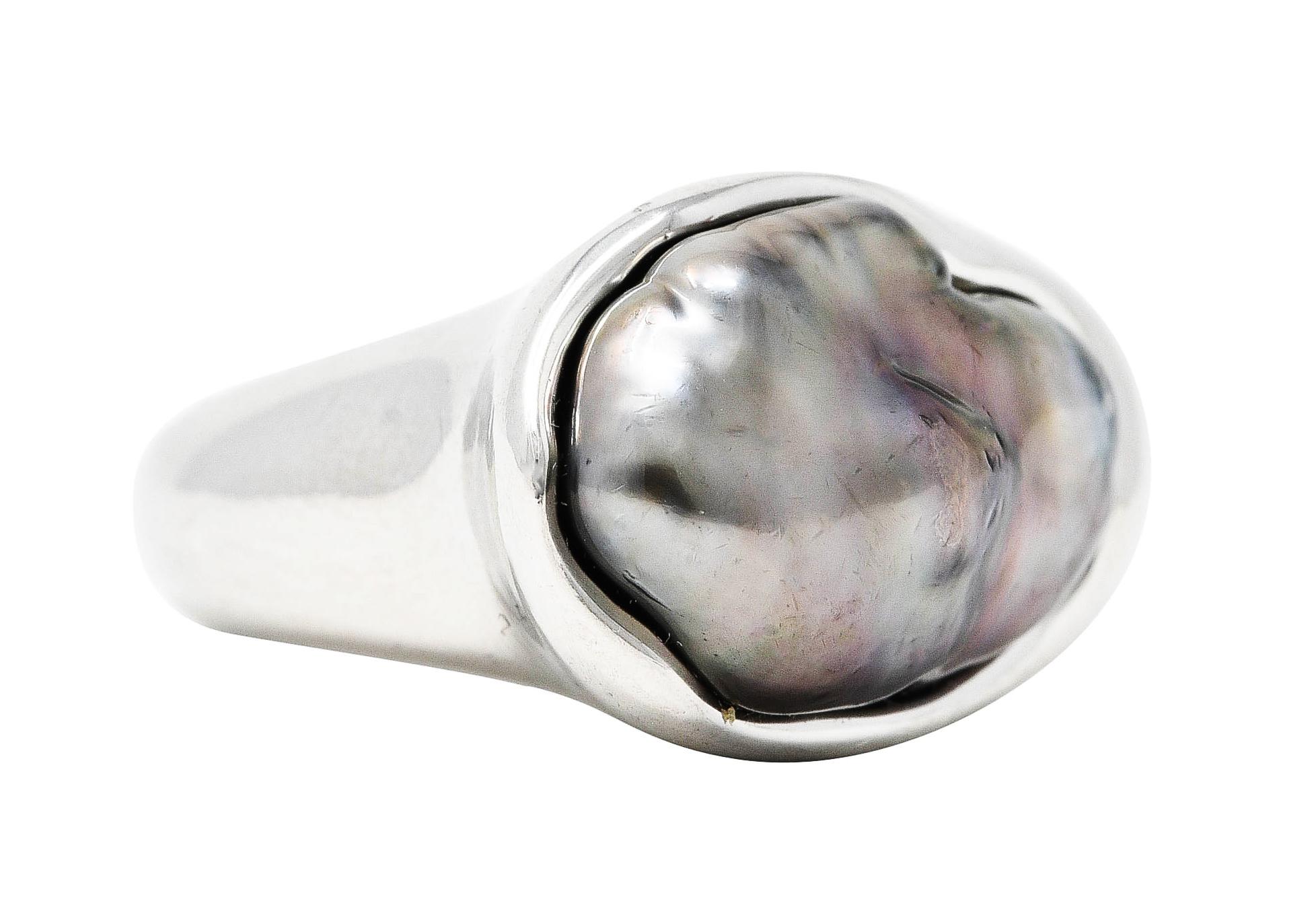 Bold band is organically formed while centering a baroque Tahitian pearl

Gray in body color with strong iridescence and excellent luster

Set low and surrounded by a waved but polished platinum edge

Stamped PT950 for platinum

Signed Peretti and