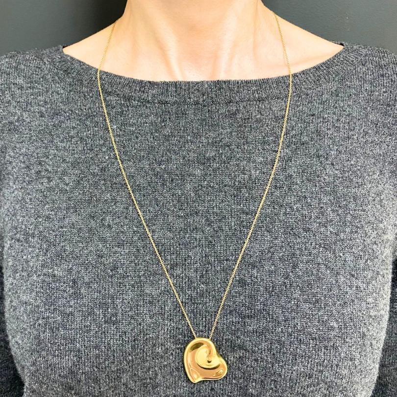 DESIGNER: Elsa Peretti for Tiffany & Co.
CIRCA: Late 20th Century
MATERIALS: 18K Yellow  Gold
WEIGHT: 14.1 Grams
MEASUREMENTS: Chain - 27