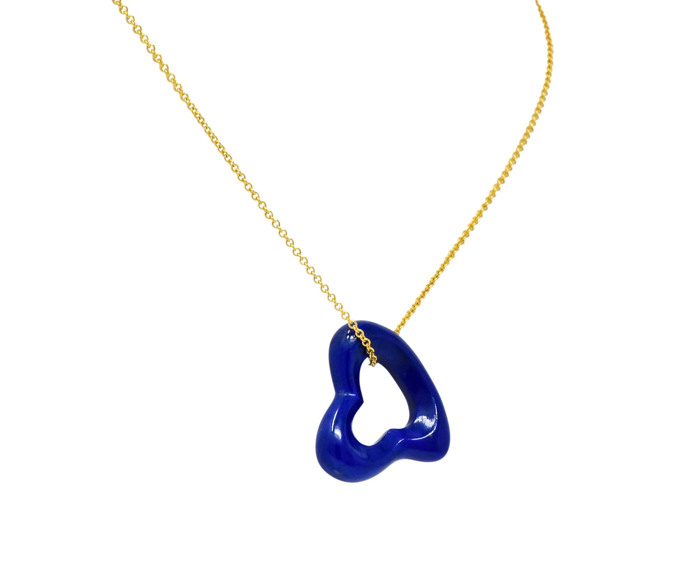 Featuring a carved and polished lapis lazuli, bright royal blue with tiny flecks of pyrite

On a cable style chain with spring ring clasp

From her popular Open Heart collection

Chain fully signed Tiffany & Co., Peretti for Elsa Peretti and stamped