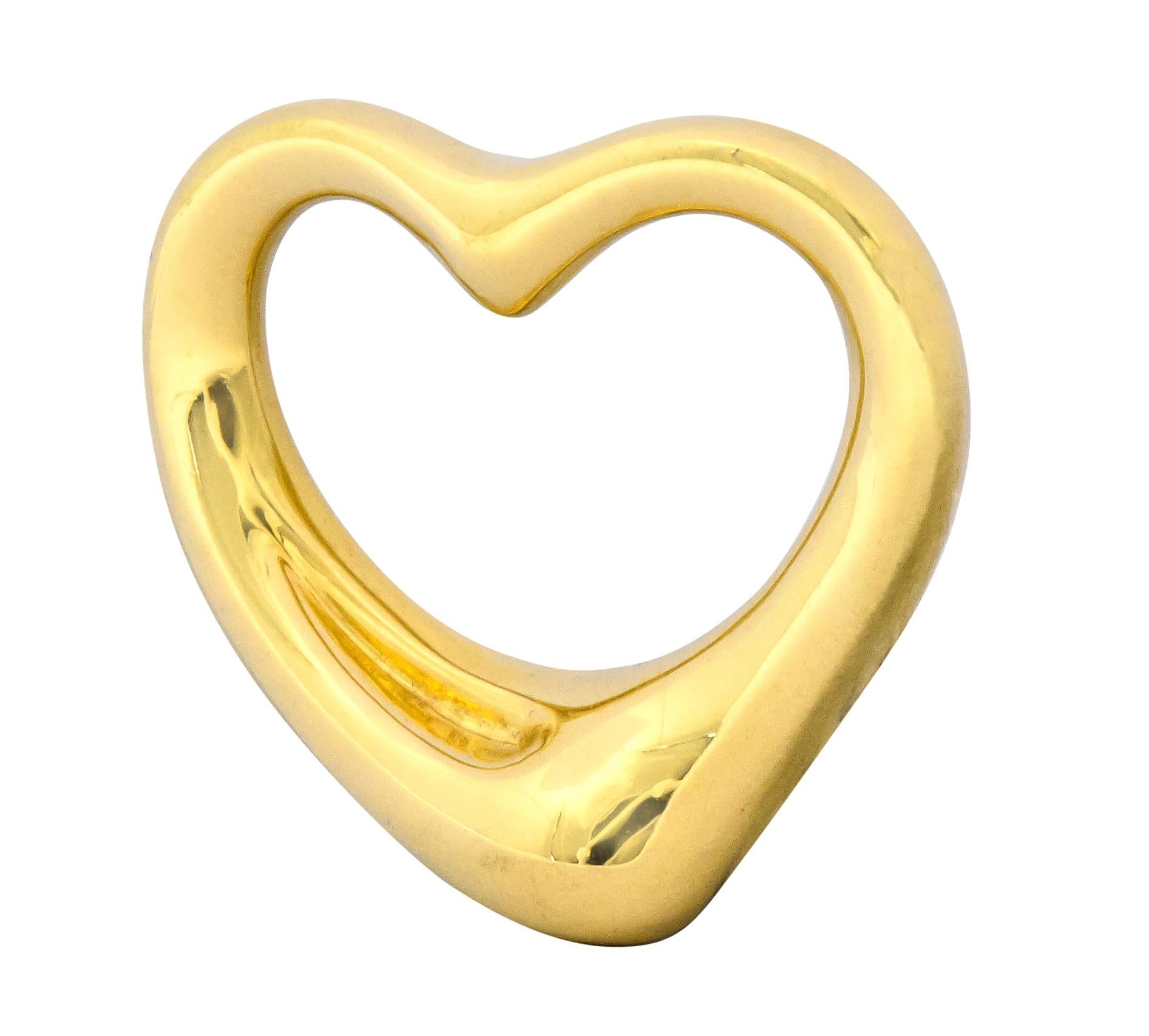 Pendant is designed as a gleaming open heart motif

Fully signed Tiffany & Co. Elsa Peretti Spain

Stamped 750 for 18 karat gold

From the vintage Open Heart collection, circa 1990s

Measures: 1 x 1 inch (25.0 mm)

Total weight: 8.0 grams

Romantic.