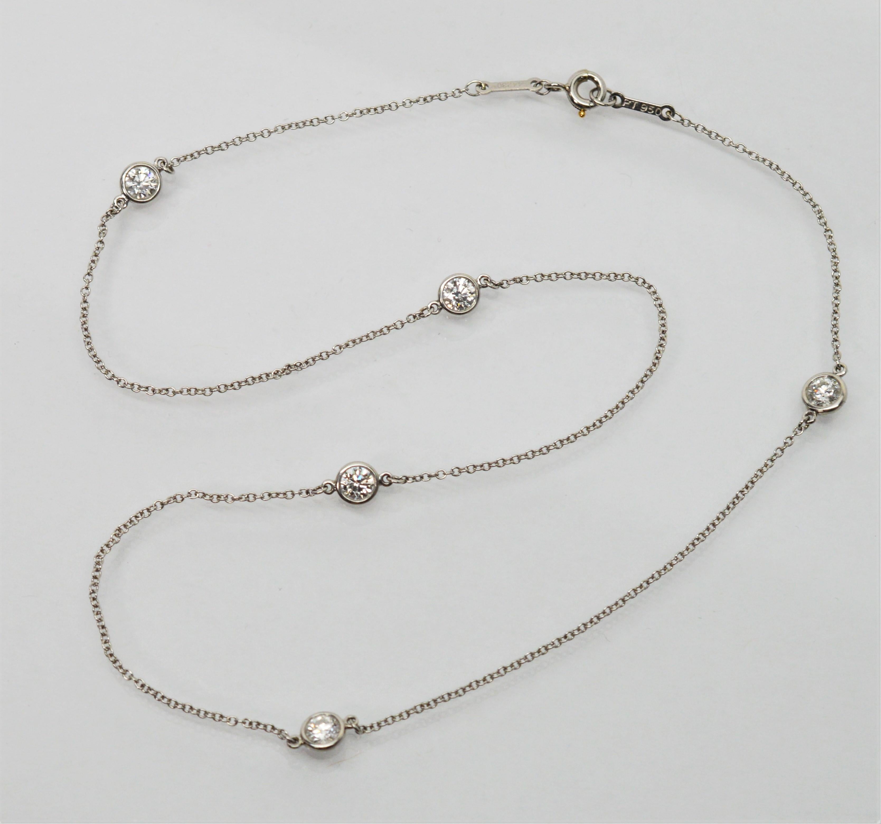 Five Stone Diamond Station Necklace by Elsa Peretti for Tiffany & Company. A simple and elegant design by Elsa Peretti, with floating diamond stations on a fifteen inch platinum chain necklace that create a fresh light look. The diamond stations are