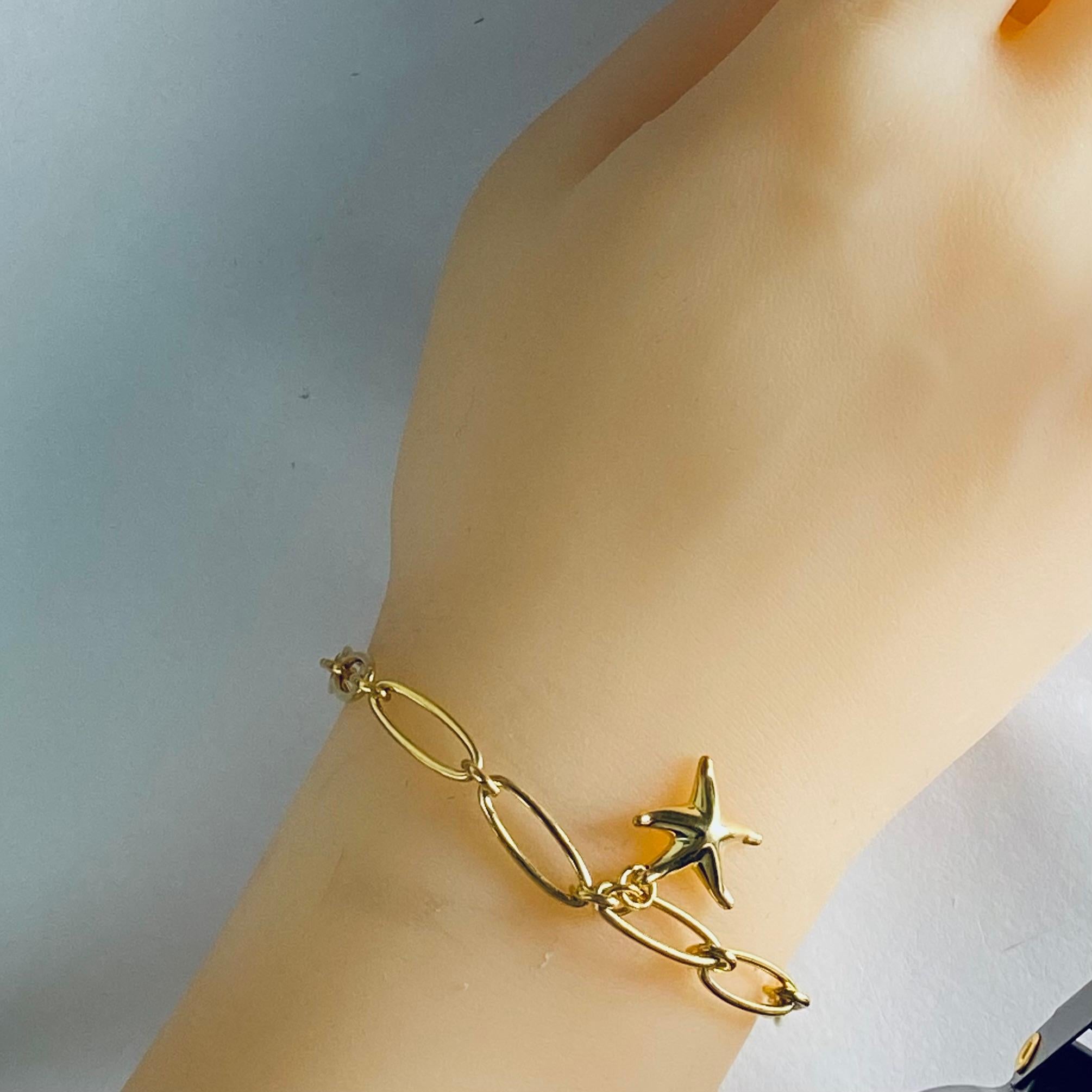 Contemporary Elsa Peretti Tiffany Gold Tone Silver Oval Link Bracelet with Starfish Charm