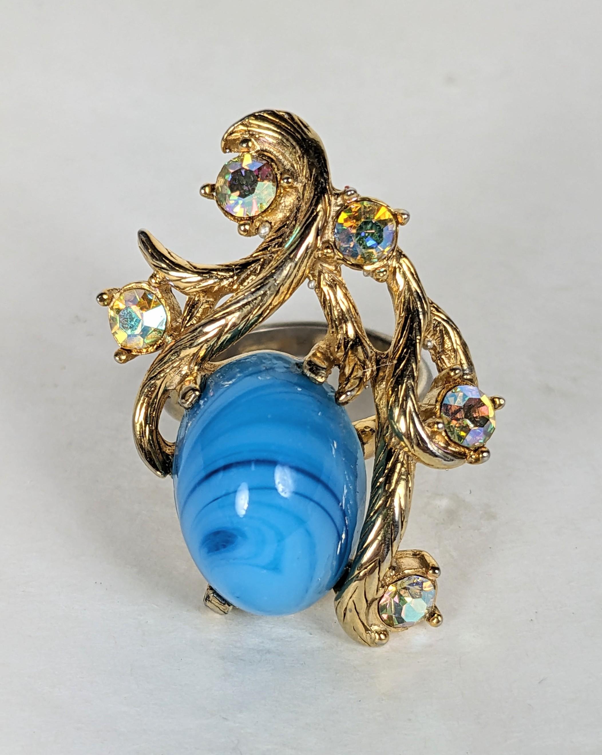 Elsa Schiaparelli Baroque Revival Cocktail Ring. Composed of leafy vine motif textured gilt plate base metal, faux Tibetan turquoise oval cabochon, with aurora iridized glass, in pink/blue/gold faceted  rhinestones. Excellent Condition,