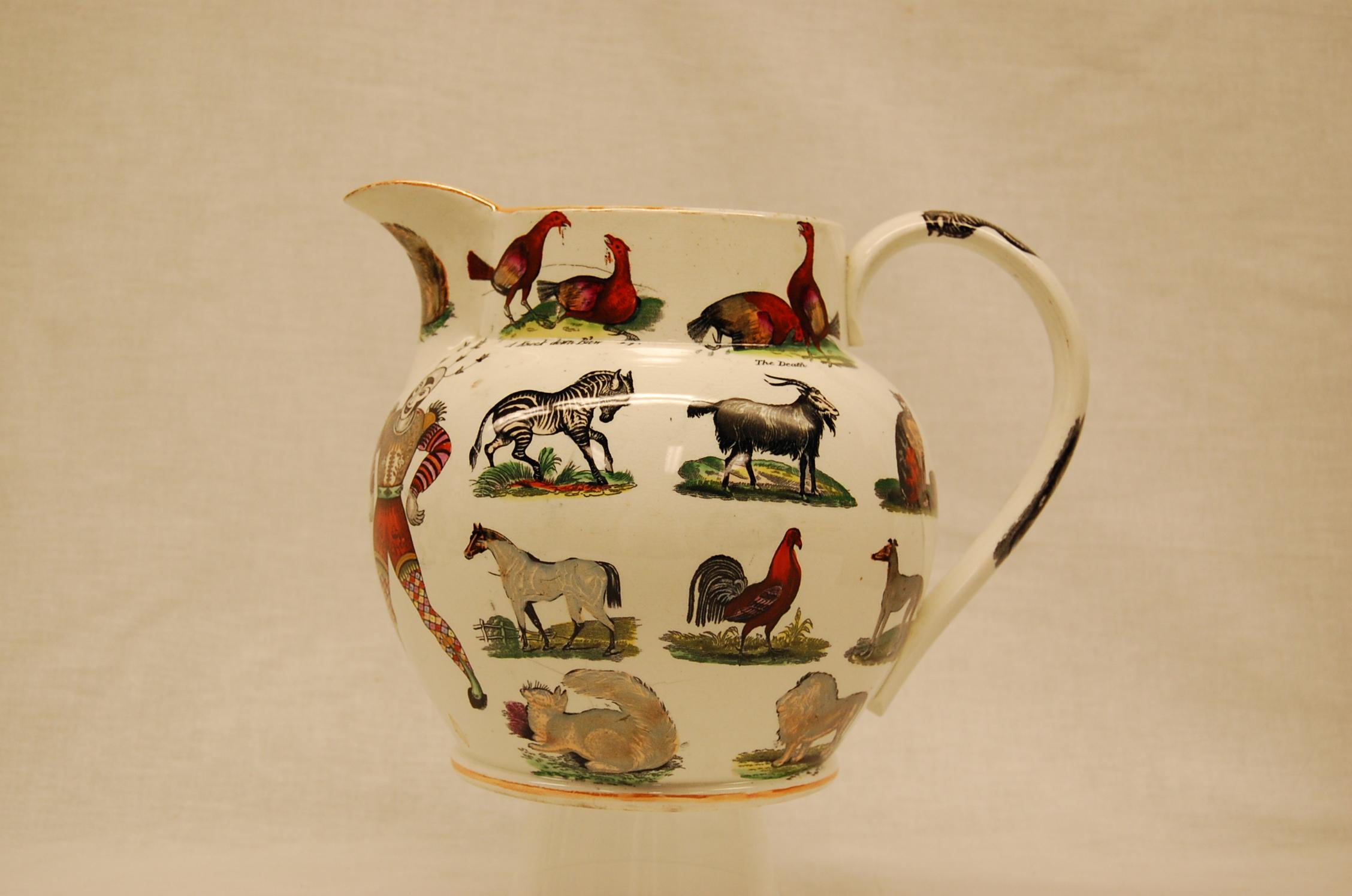 A superb, large, circa 1850 English ironstone ale jug manufactured by Elsmore & Forster, Turnstill, England in the Harlequin pattern, additionally desirable as is it exuberantly decorated in vibrantly-colored lusterware transfers of exotic, woodland