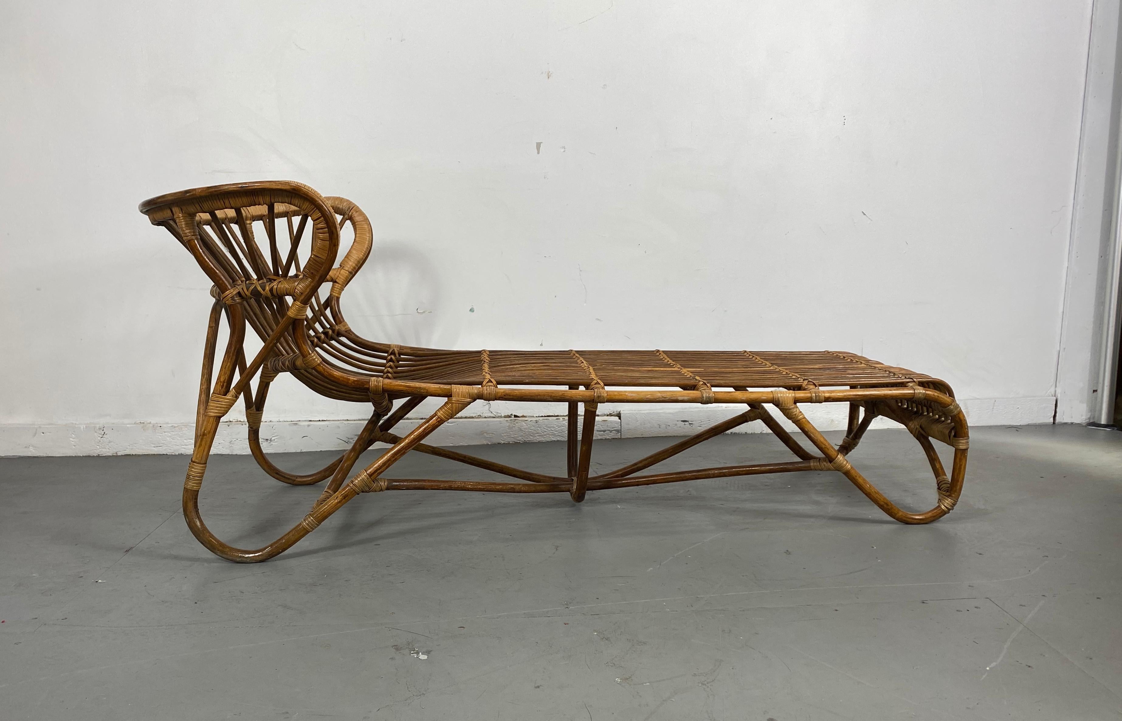 Rattan and bamboo chaise lounge chair designed in the 1960s. Amazing original condition. Hand delivery avail to New York City or anywhere en route from Buffalo NY.