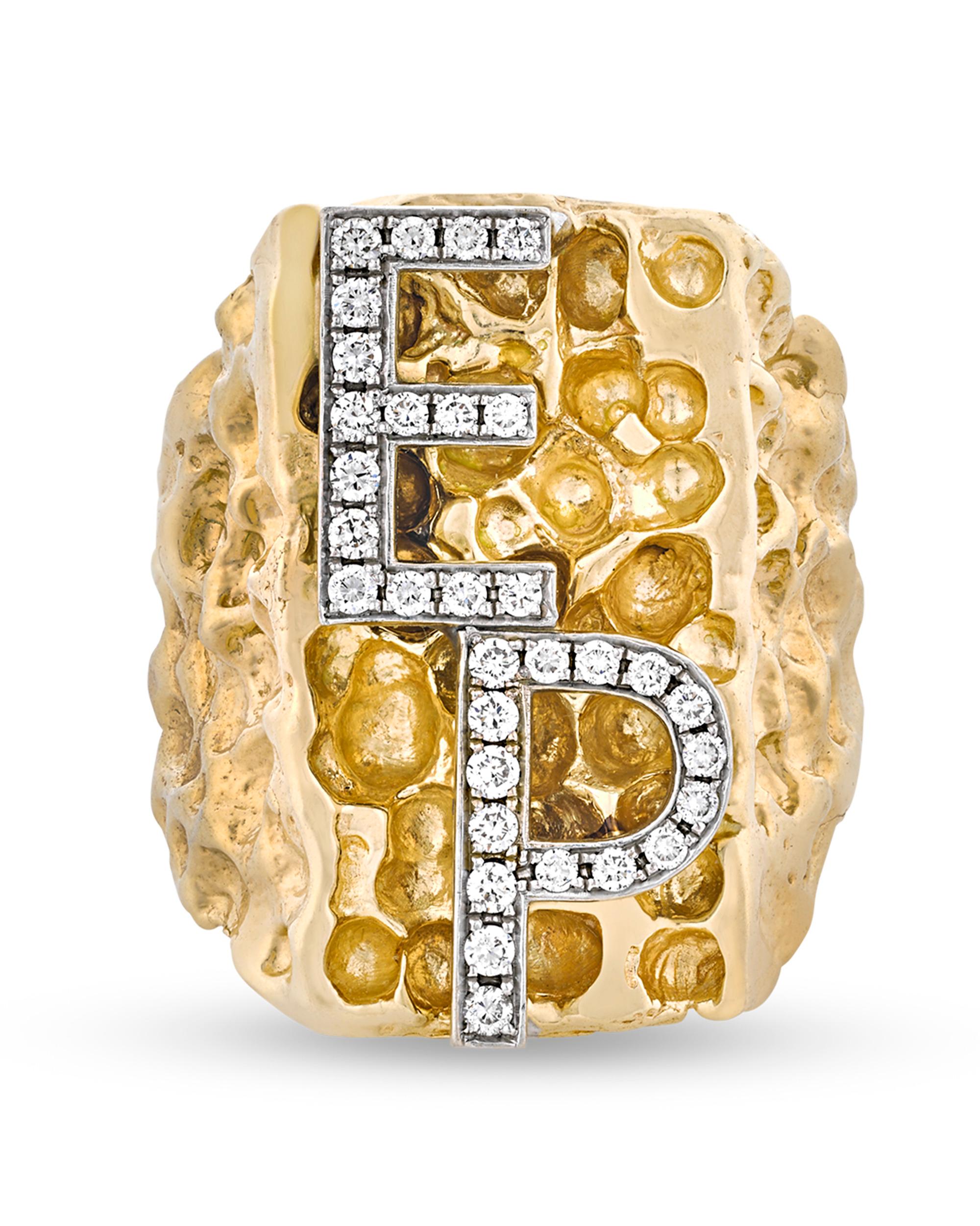 Sensational and completely one of a kind, this ring was made especially for the king of rock 'n' roll, Elvis Presley. The legendary entertainer's initials 