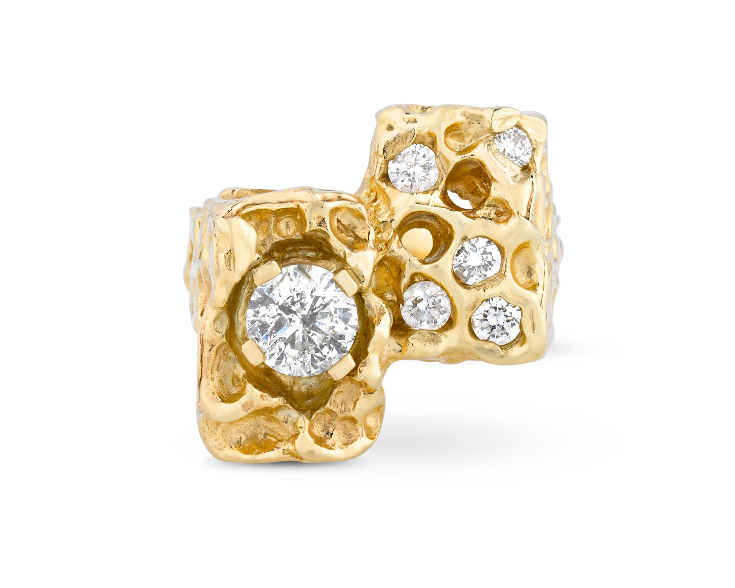 This ring was once owned and worn by one of the most celebrated cultural icons of the 20th century, Elvis Presley. Crafted from hammered 14K yellow gold, the impressive ring's highly sculptural form is inset with six white diamond accents, the