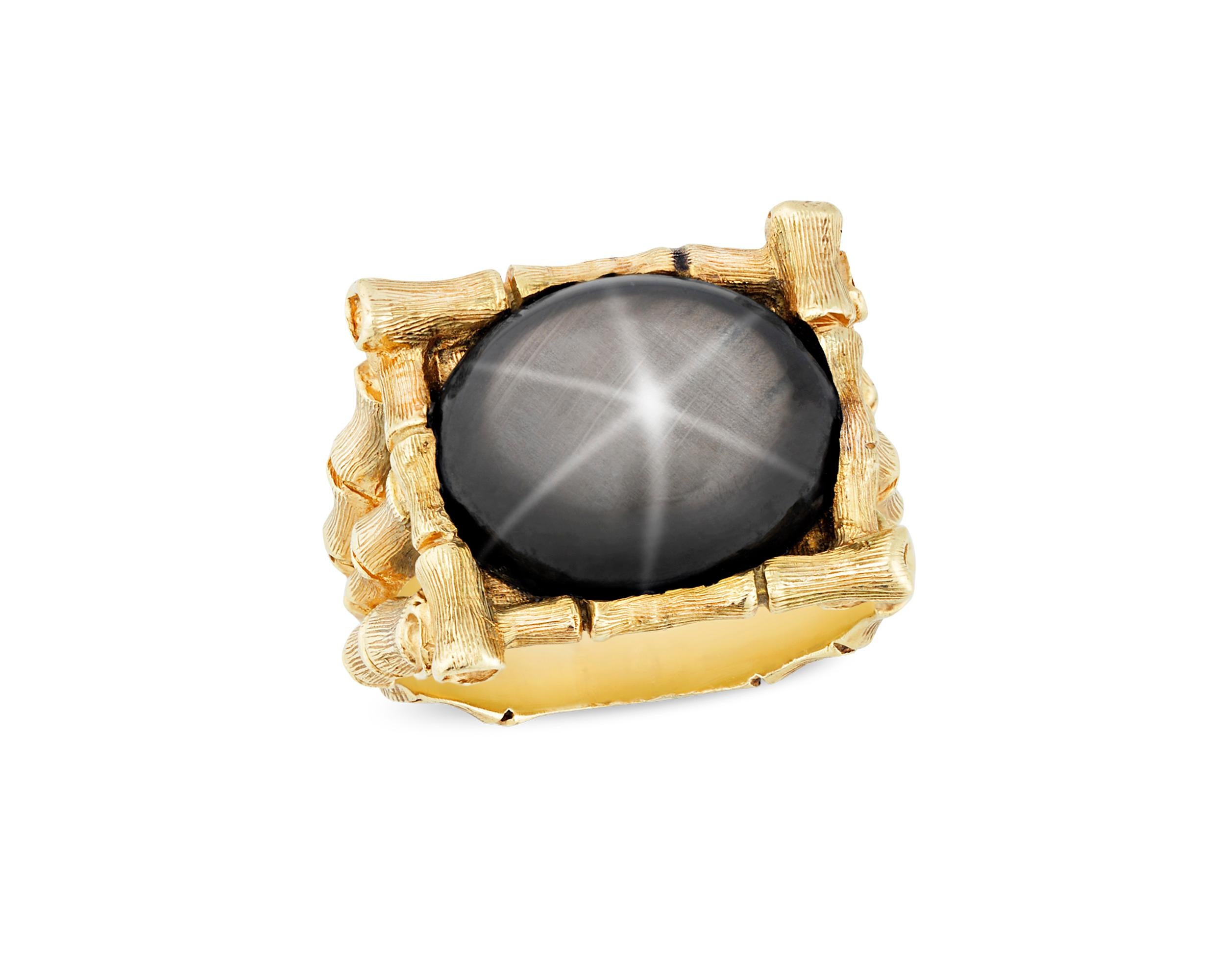 This fascinating ring was owned and worn by perhaps the most celebrated cultural icon of the 20th century, the King himself, Elvis Presley. At the center of the ring sits a monumental black star sapphire, among the most unique variety of sapphires