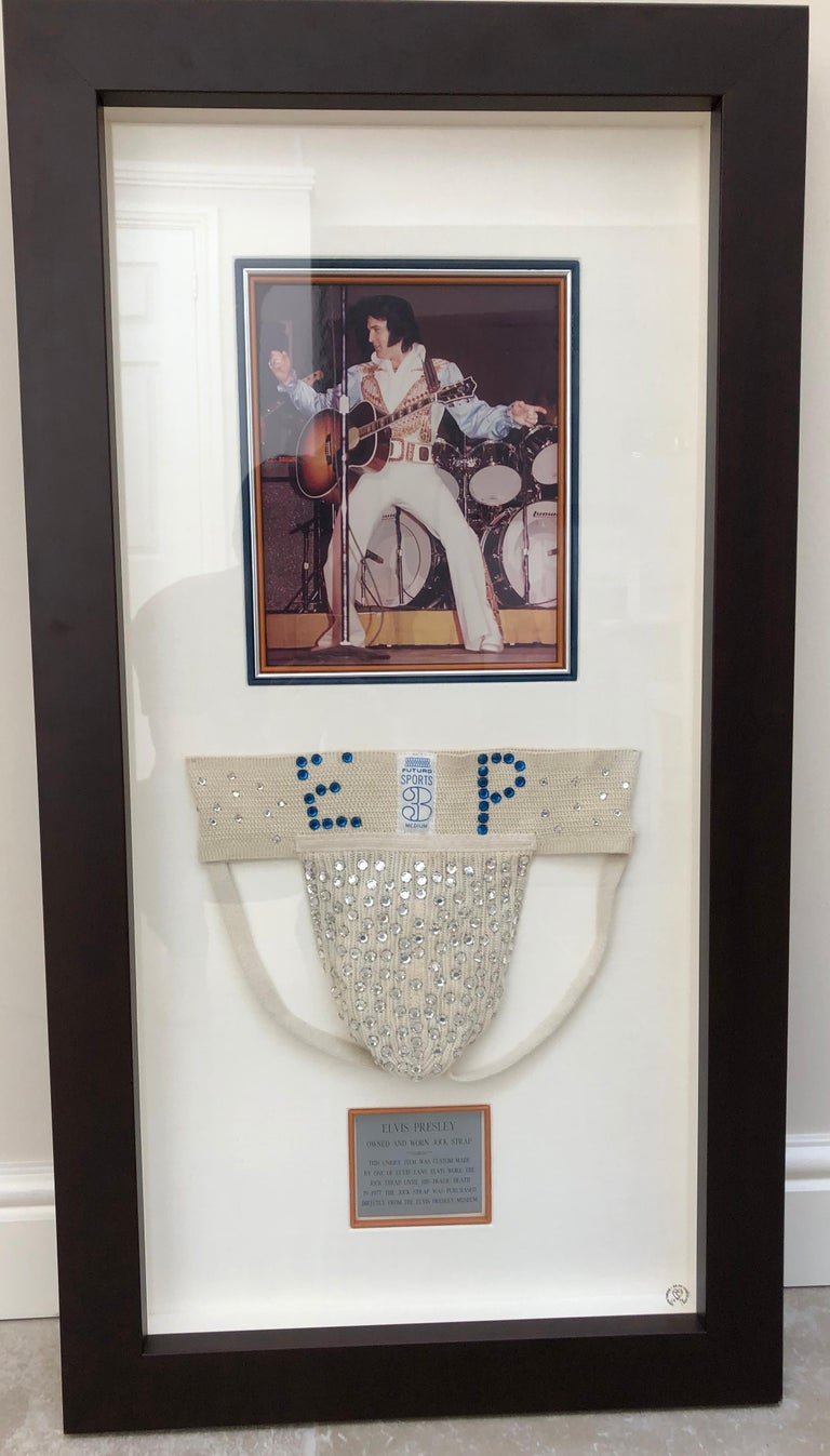 A rhinestone jockstrap bearing Elvis Presley’s initials (“EP”). Once housed in the Elvis Presley Museum collection in Memphis, curated by Elvis' long time friend Jimmy Velvet. 

According to Velvet, the jockstrap was gifted to Elvis by a fan.