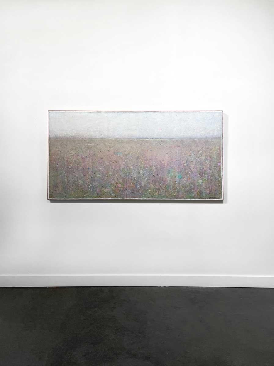 This large abstract landscape painting by Elwood Howell features a soft palette. A high horizon line runs the width of the composition, with of pink, green, blue, orange, and green specks, shapes, and strokes layered overtop of one another beneath
