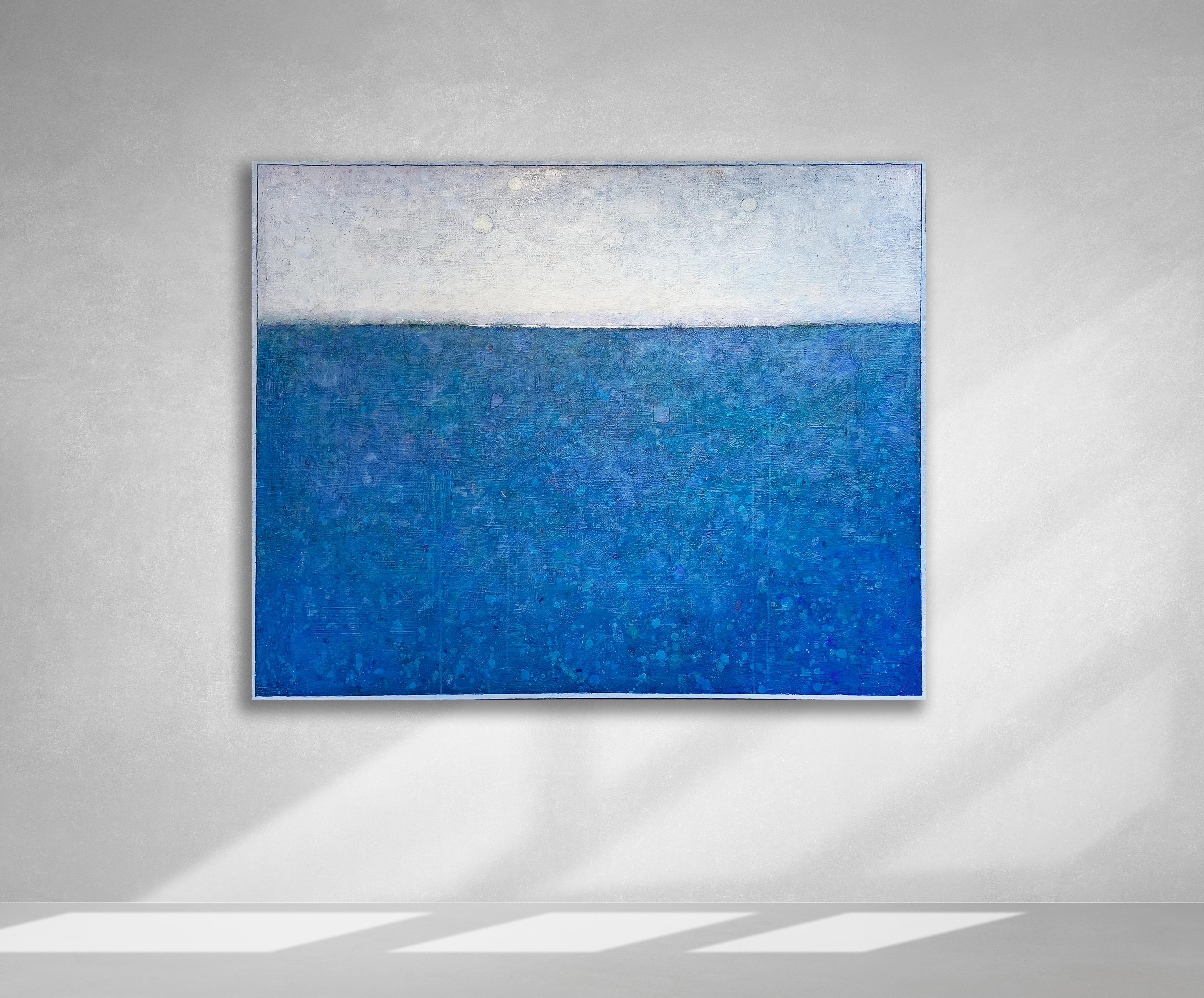 This large-scale statement piece by Elwood Howell is a primarily brilliant blue color with specks and shapes of purple, teal, and green floating throughout. A stark horizon line is dark on the sides with white at the center, and the "sky" above the