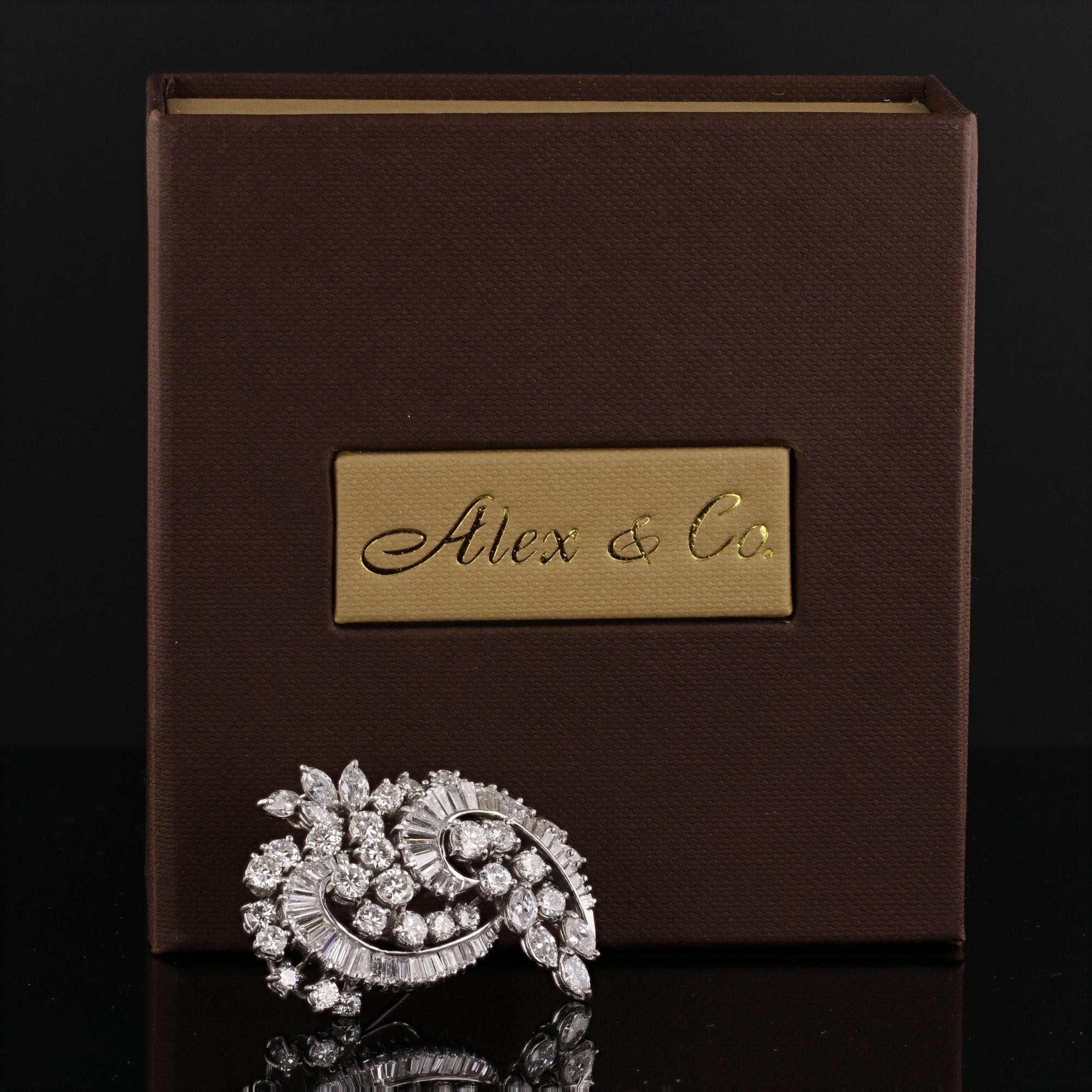 This outstanding brooch/pendant is crafted in solid platinum by renowned designer Elwood Van Clief, offered by Alex & Co.  This estate piece from the 1950's era features 26 round brilliant cut diamonds, 10 marquise shaped diamonds and 48 baguettes.