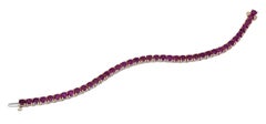 Ely Adams, 16.00 Carat Round Ruby Tennis Bracelet in Yellow Gold