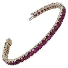 Ely Adams, 16.00 Carat Round Ruby Tennis Bracelet in Yellow Gold