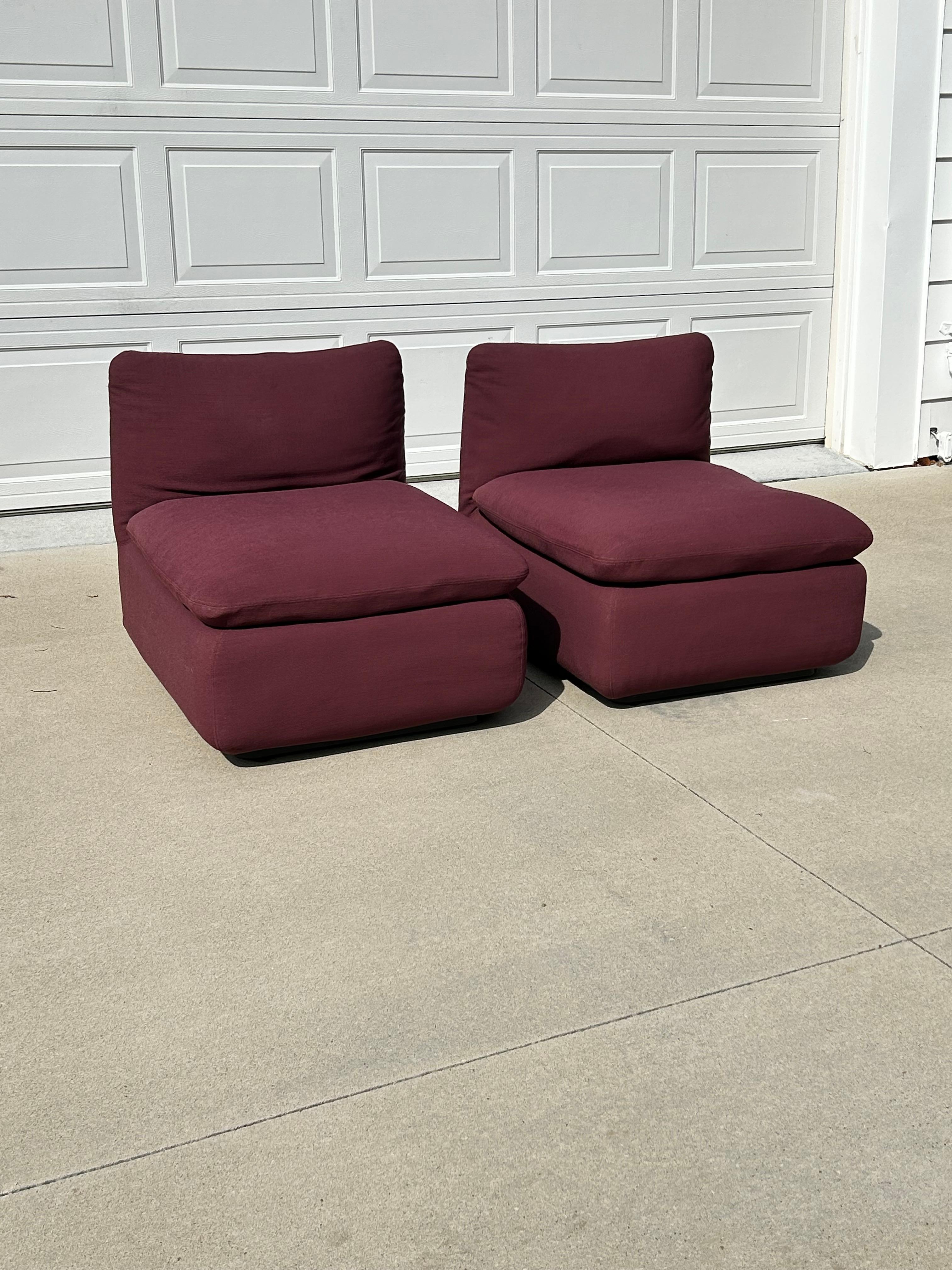 Set of 2 Steelcase Modular Ganging Elysee Chairs in original plum performance fabric.  The chairs do feature a bracket underneath to be able to combine the two and set them up as a stationary postmodern loveseat sofa.
Both of the chairs are very