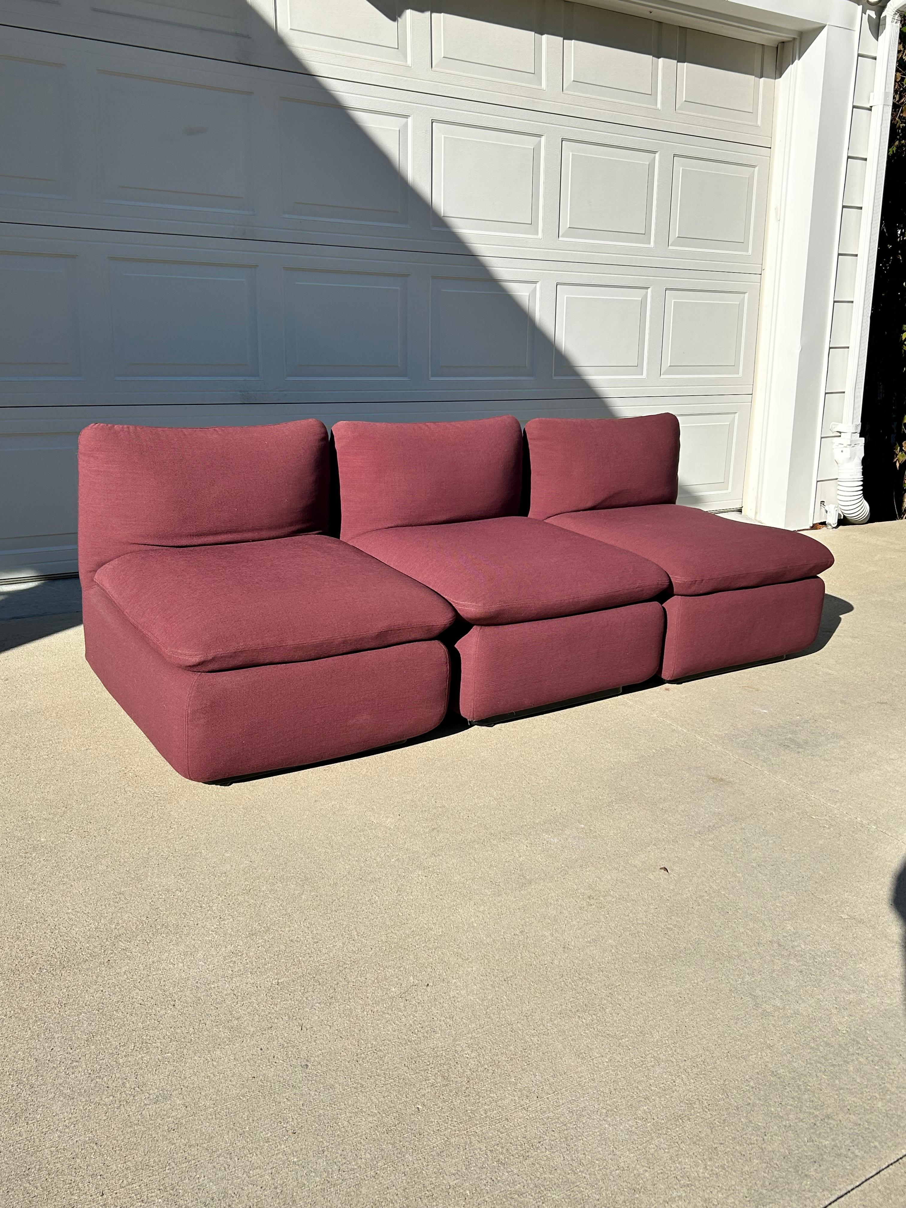 Steelcase Modular Ganging Elysee Sofa in original plum performance fabric.  The genius design of this modular sofa by Steelcase, connects all three seating units (chairs) by a steel bracket and hardware underneath.  So it can be used easily as three