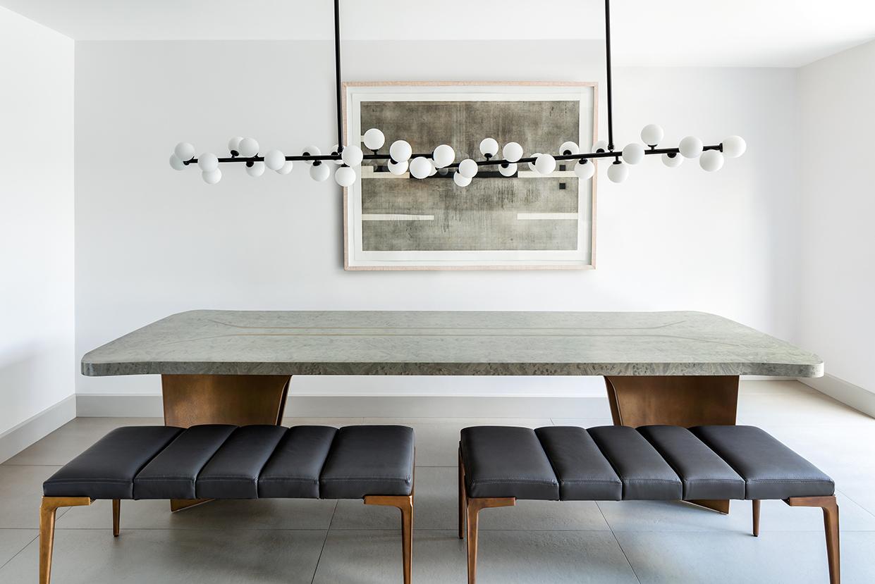 The Elysian dining table is like nothing else, as if conceived in another world, the gentle yet complex silhouette redefines one’s expectation of a tables form, creating a beautifully subtle yet iconic object. A gentle nod to the elegant base is