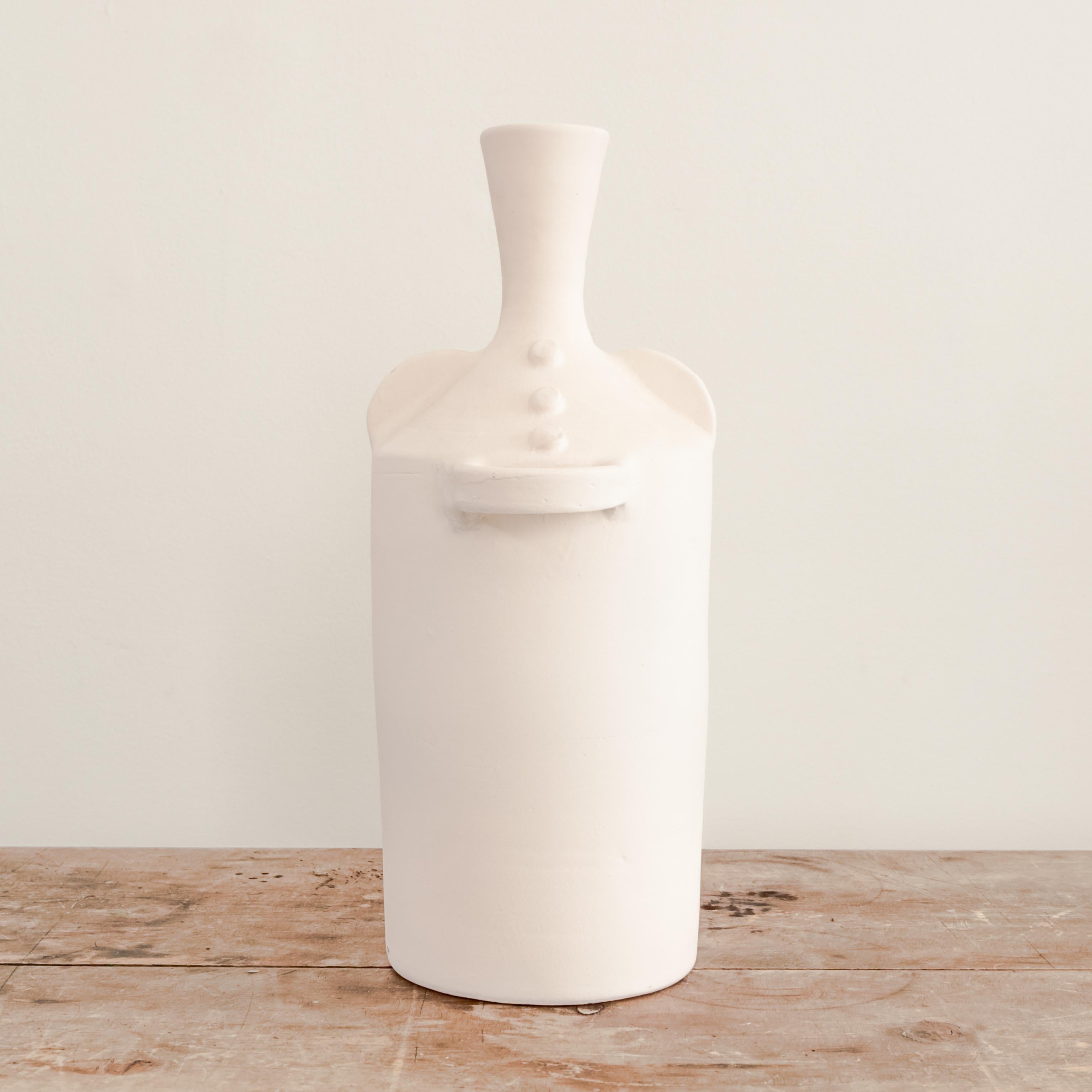 Unglazed white ceramic Elysian vase with handles.