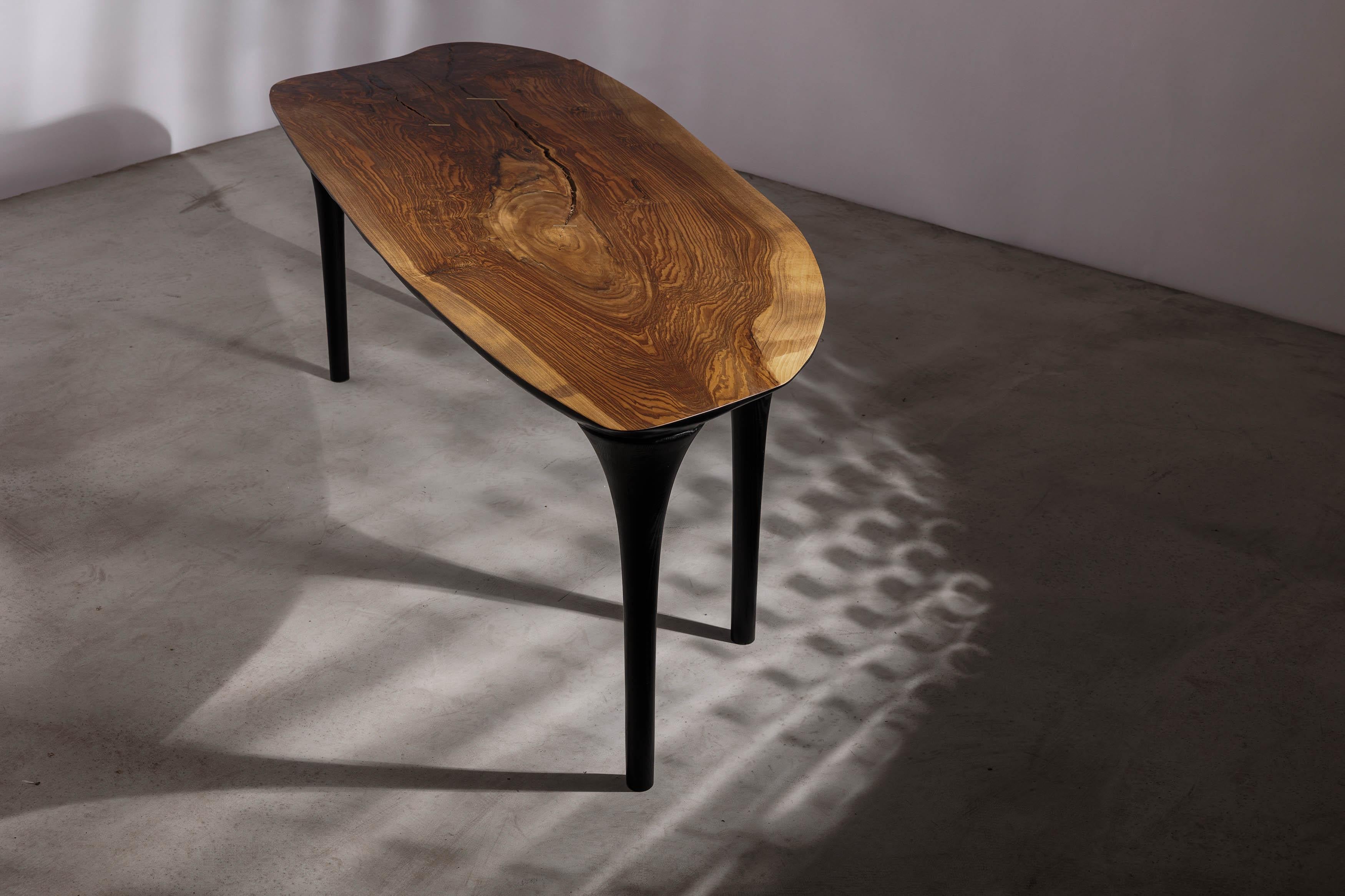 EM211 dning table by Eero Moss
One of a kind
Dimensions; W 240 x D 85 x H 78 cm
Materials: Walnut, ash, India ink.
Finish: Natural oils.

Erosio Collection

This collection is an ode to the fluid, organic shapes found in the natural world.