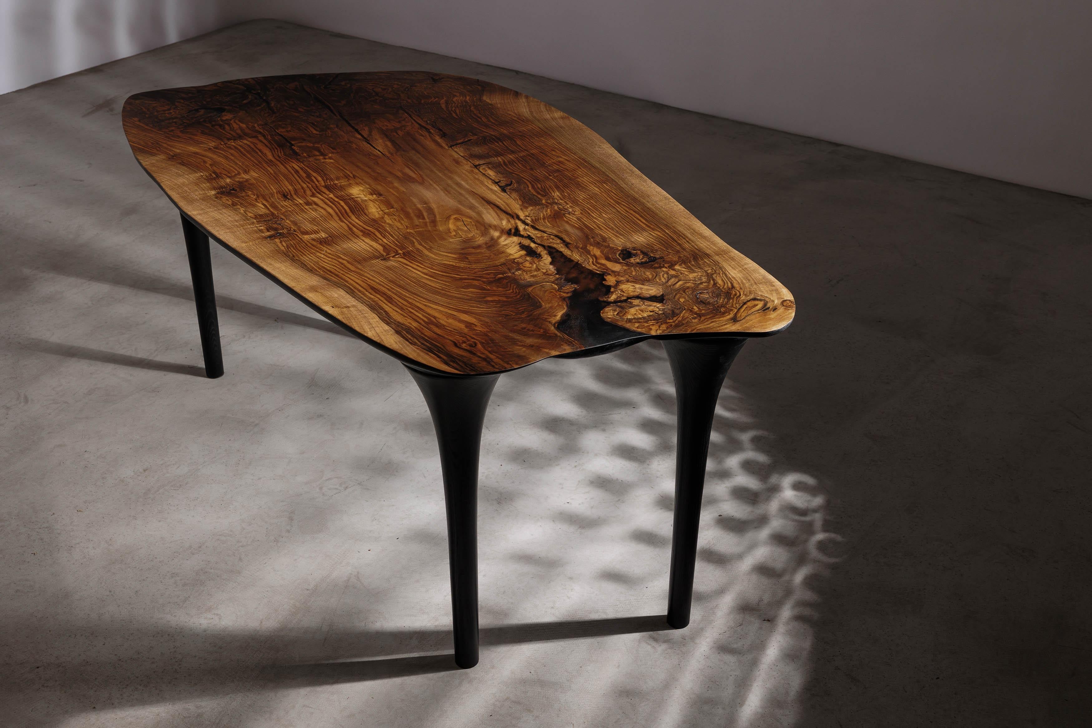 EM212 dining table by Eero Moss
One of a kind
Dimensions; W 175 x D 98 x H 78 cm
Materials: Walnut, ash, India ink.
Finish: Natural oils.

Erosio Collection

This collection is an ode to the fluid, organic shapes found in the natural world.