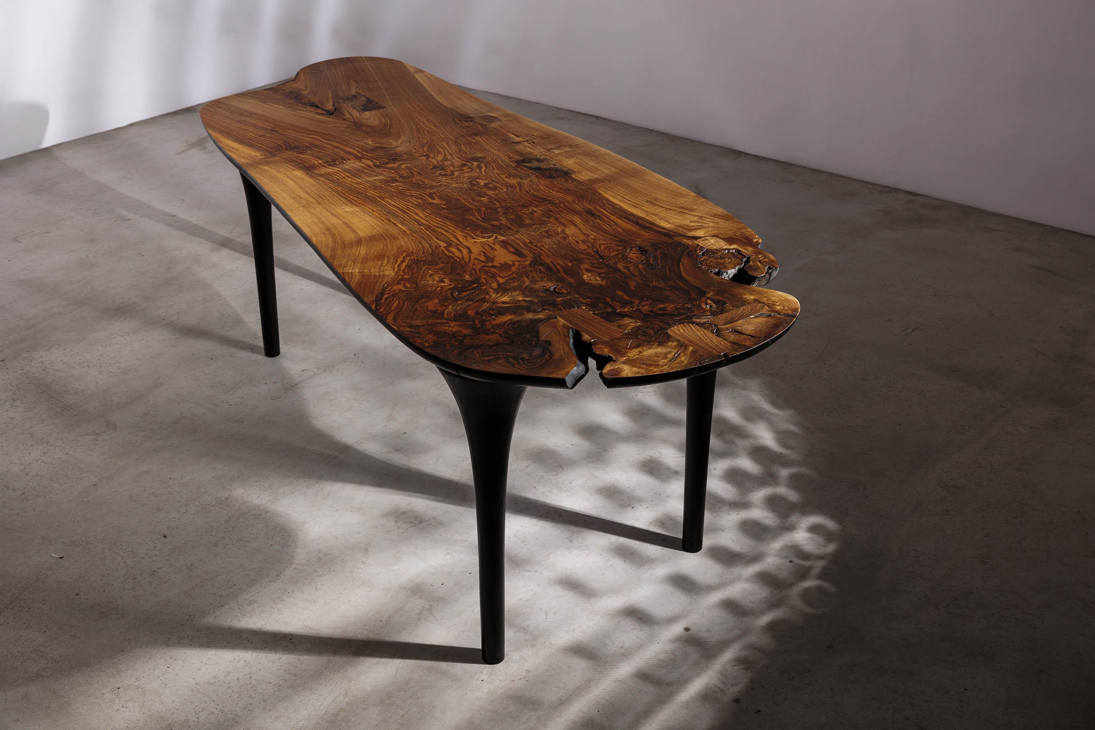 EM213 dining table by Eero Moss
One of a kind
Dimensions; W 218 x D 85 x H 78 cm
Materials: Walnut, ash, India ink.
Finish: Natural oils.

Erosio Collection

This collection is an ode to the fluid, organic shapes found in the natural world.