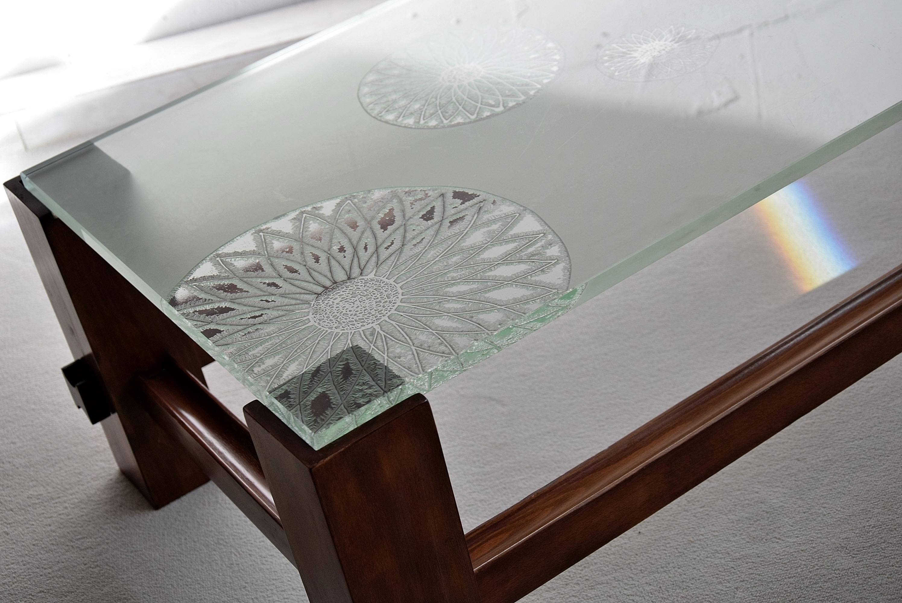 Fontana Arte Mid-Century Modern coffee table by Max Ingrand.
Stylish and sophisticated tainted beech coffee table designed by Max Ingrand for Fontana Arte in the 1960s. This version of model 2461 is rare to come by with the etched sunflowers thick