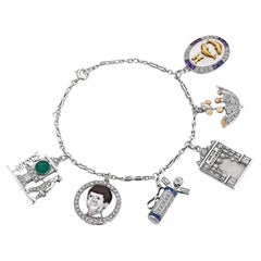 Emanuel Cohen Platinum Diamond Gold Sapphire Emerald Art Deco Charm Bracelet