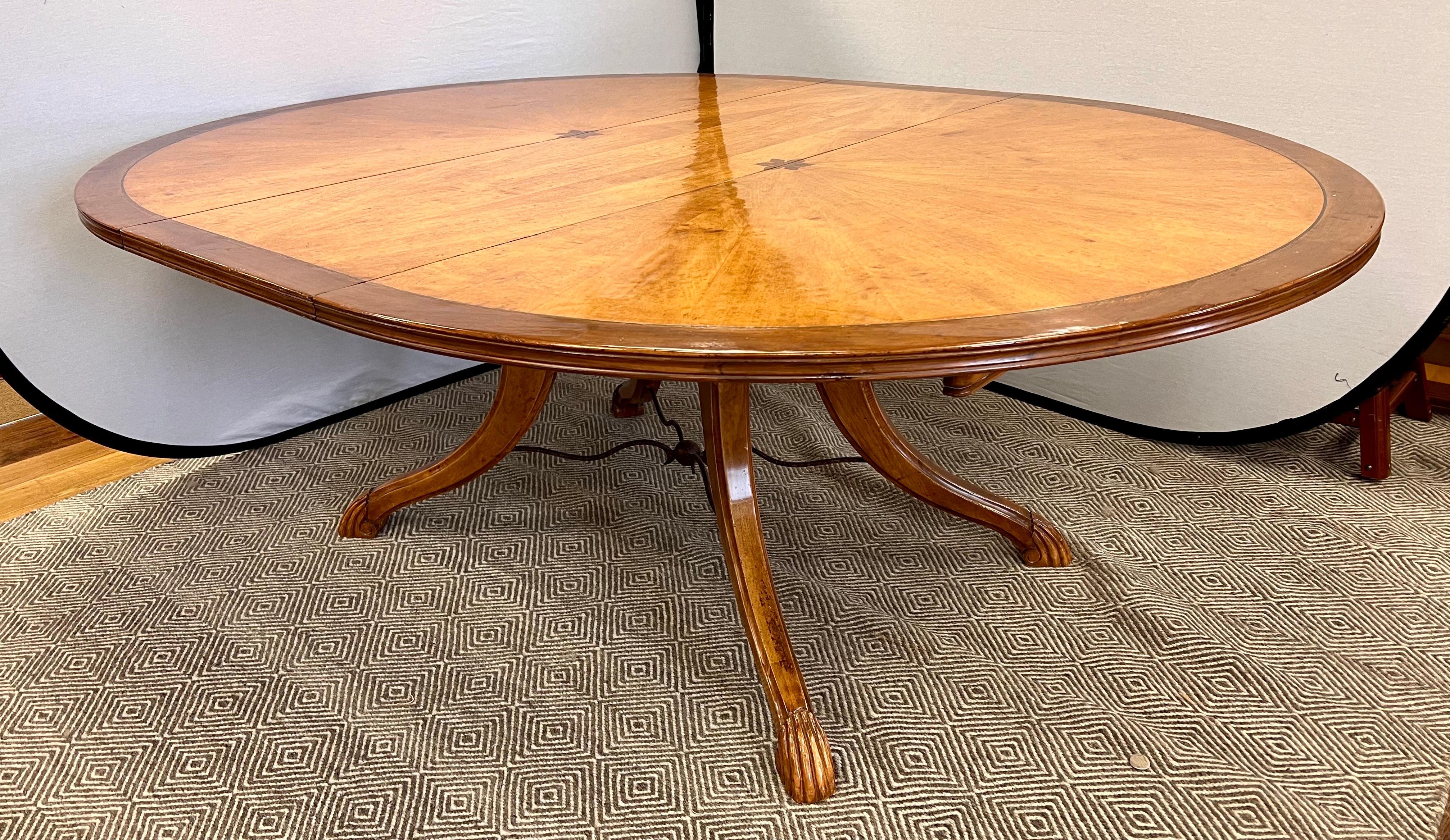Stunning handcrafted custom banded pedestal dining table by Emanuel Morez. 
Finished with walnut banding on cherry finish.
Hand-planed, distressed, antiqued, and waxed.
Sunburst pattern top with brass inlay.
Carved claw feet with cross iron