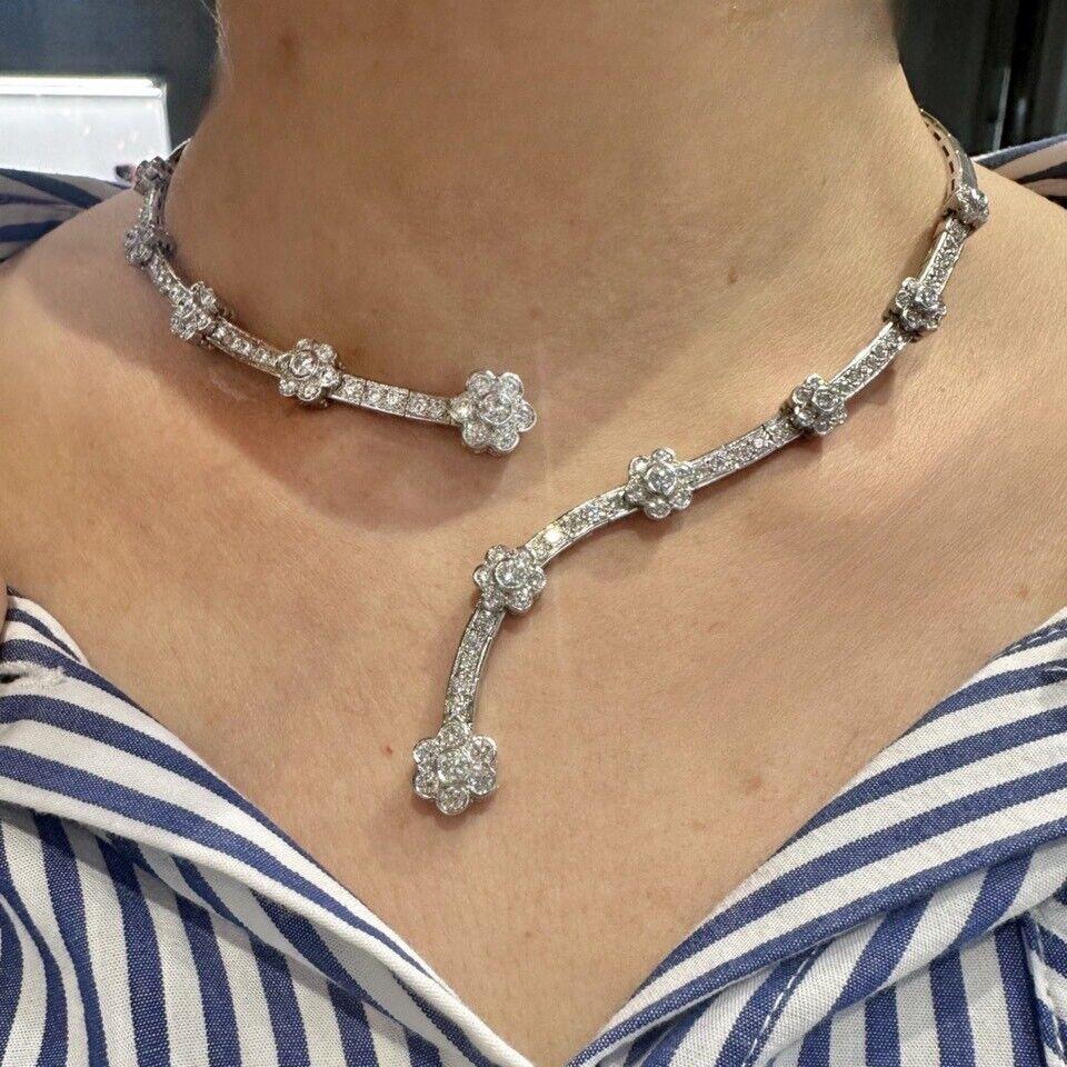 Brand: Emanuel Sharp

Style: Collar Necklace
Metal: White Gold 

Metal Purity: 18K

Main Stone Cut: round shaped​​​​​​​

Motif: Flower

Diamond Clarity: VS1-VS2

Total Carat Weight: 4.7 Carats

Necklace Length: 17 inches

Includes: 24 Month