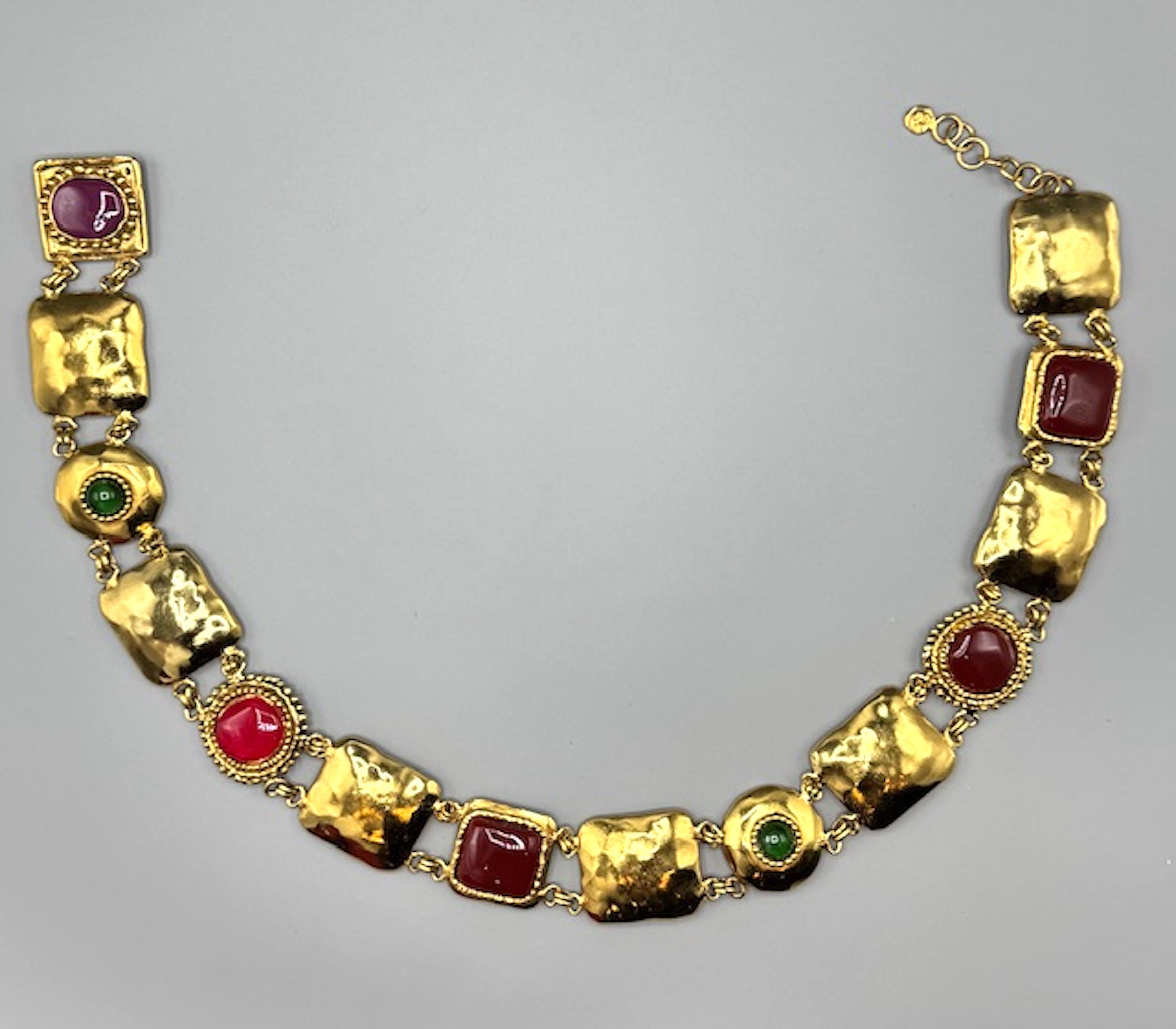 A rare 1980s vintage piece from Emanuel Ungaro when bold, statement accessories were a key part of high fashion. The combination of matte-finish gold plating and pâte de verre glass cabochons suggests a strong influence from both Art Deco and