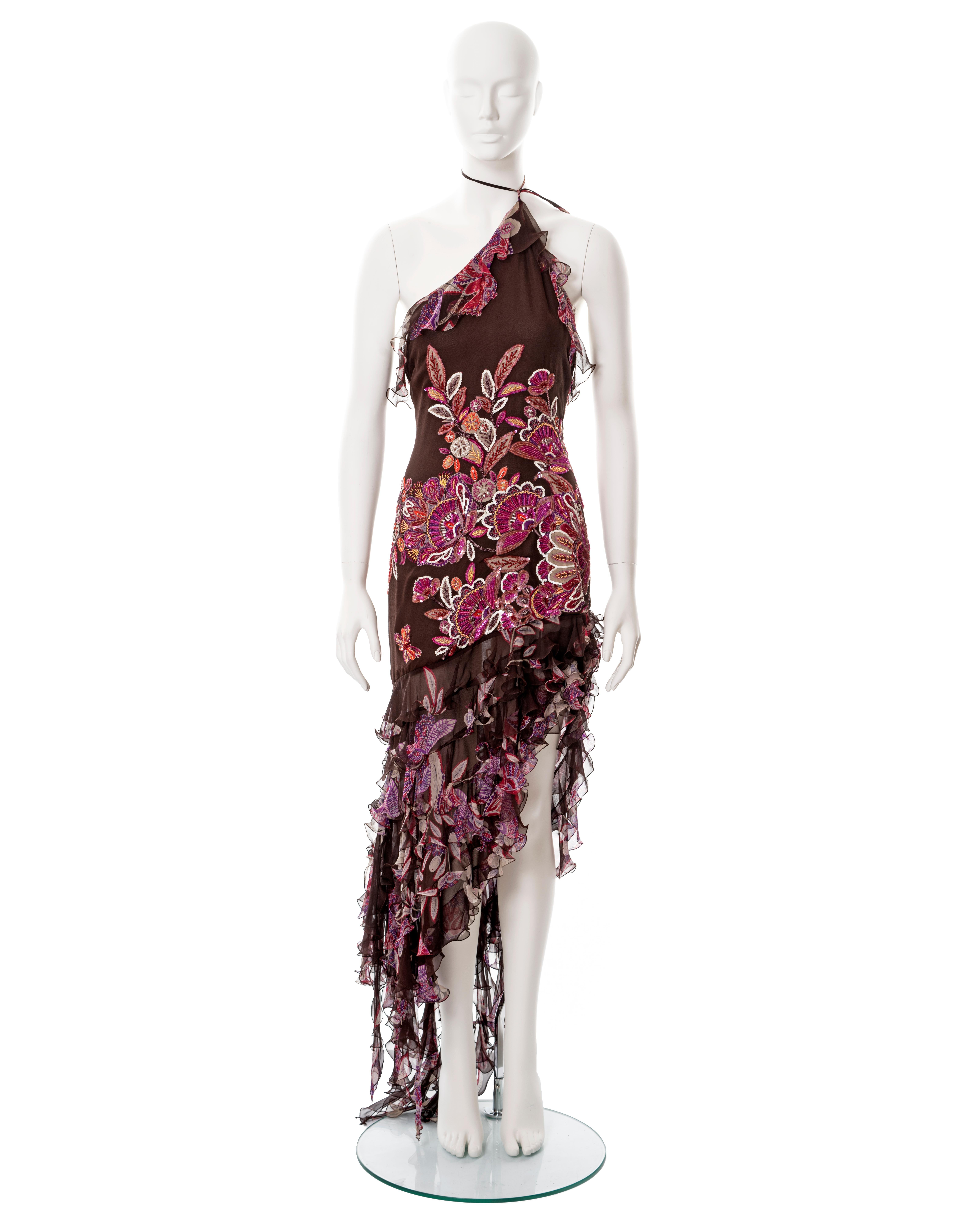 ▪ Emanuel Ungaro burgundy silk halter-neck evening dress
▪ Spring-Summer 2003
▪ Constructed from bias-cut burgundy silk chiffon 
▪ Floral and butterfly motif embellished with beads and sequins 
▪ Ruffled chiffon high-low skirt with leg slit 
▪ FR 40