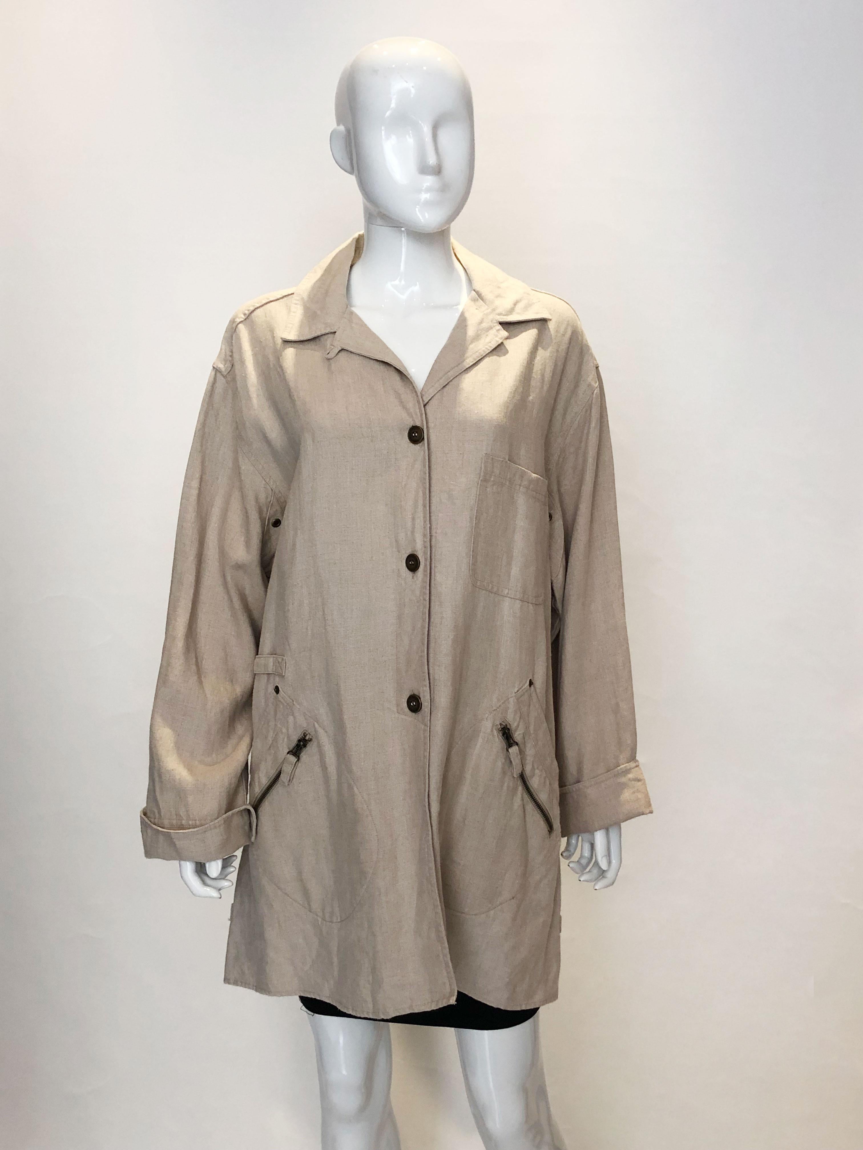 A great linen jacket by Emanuel Ungaro. The jacket is in  a heavy linen fabric with two zip pockets on the front. It should be worn loose and can fit bust up to 47'.