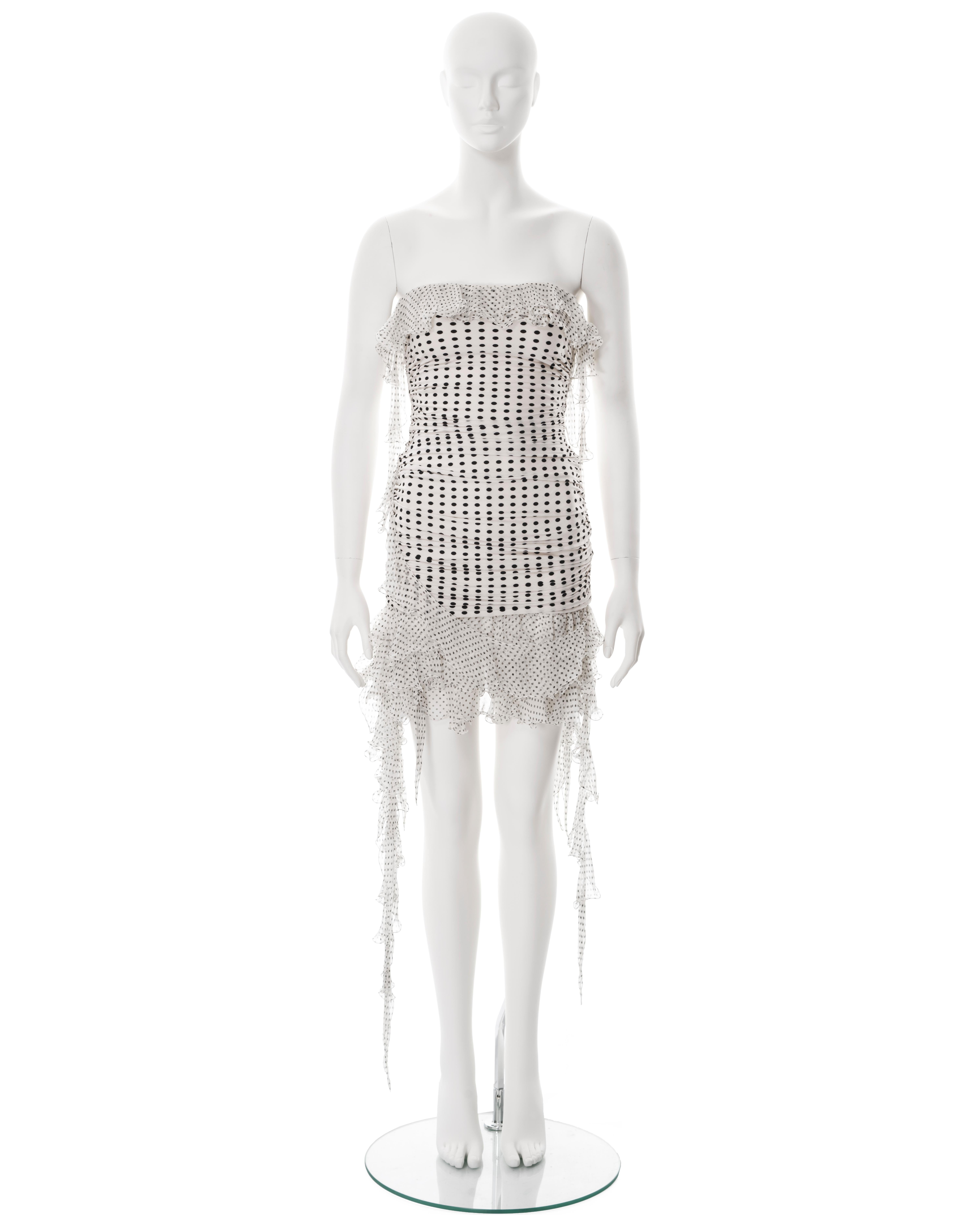 ▪ Emanuel Ungaro strapless mini dress
▪ Creative Director: Giambattista Valli
▪ Constructed from rayon jersey in a black and white polkadot print 
▪ Silk chiffon ruffled skirt and trim 
▪ Ruched side seams 
▪ Size 38

All photographs in this listing