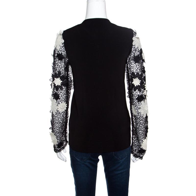 This black cardigan from Emanuel Ungaro is one piece your closet will love. Made from quality fabrics, it has front buttons and lace sleeves with floral appliques. Styled to look feminine and stylish, this number is a must-buy.

Includes: Original