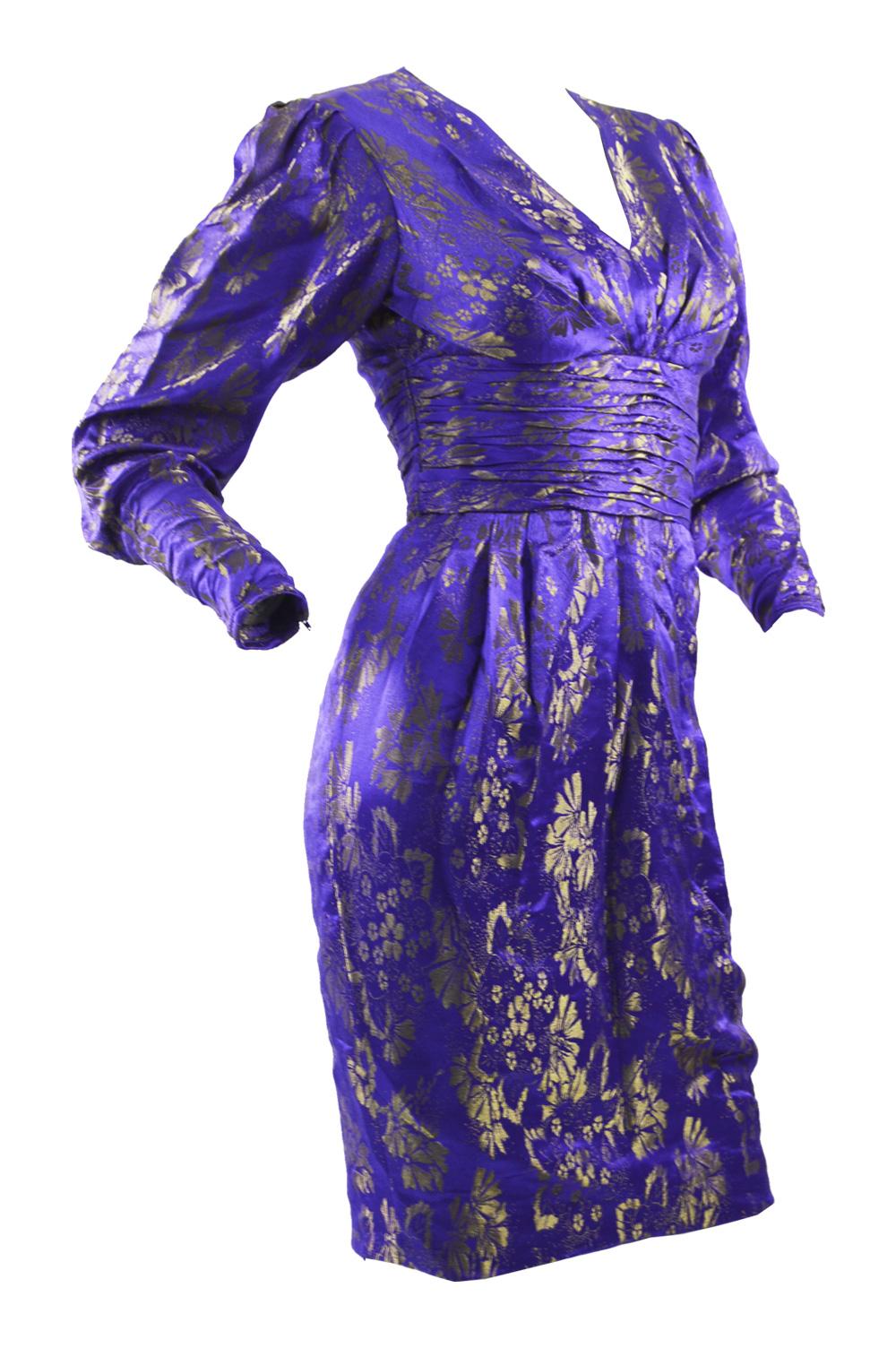 A fabulous vintage Emanuel Ungaro blue and gold silk brocade party/ evening dress from the 1980s with mutton sleeves and draping at the waist. 

Size: Marked UK 6 which is roughly a US 2/ EU 34. Please check measurements. 
Bust - 32” / 81cm
Waist -