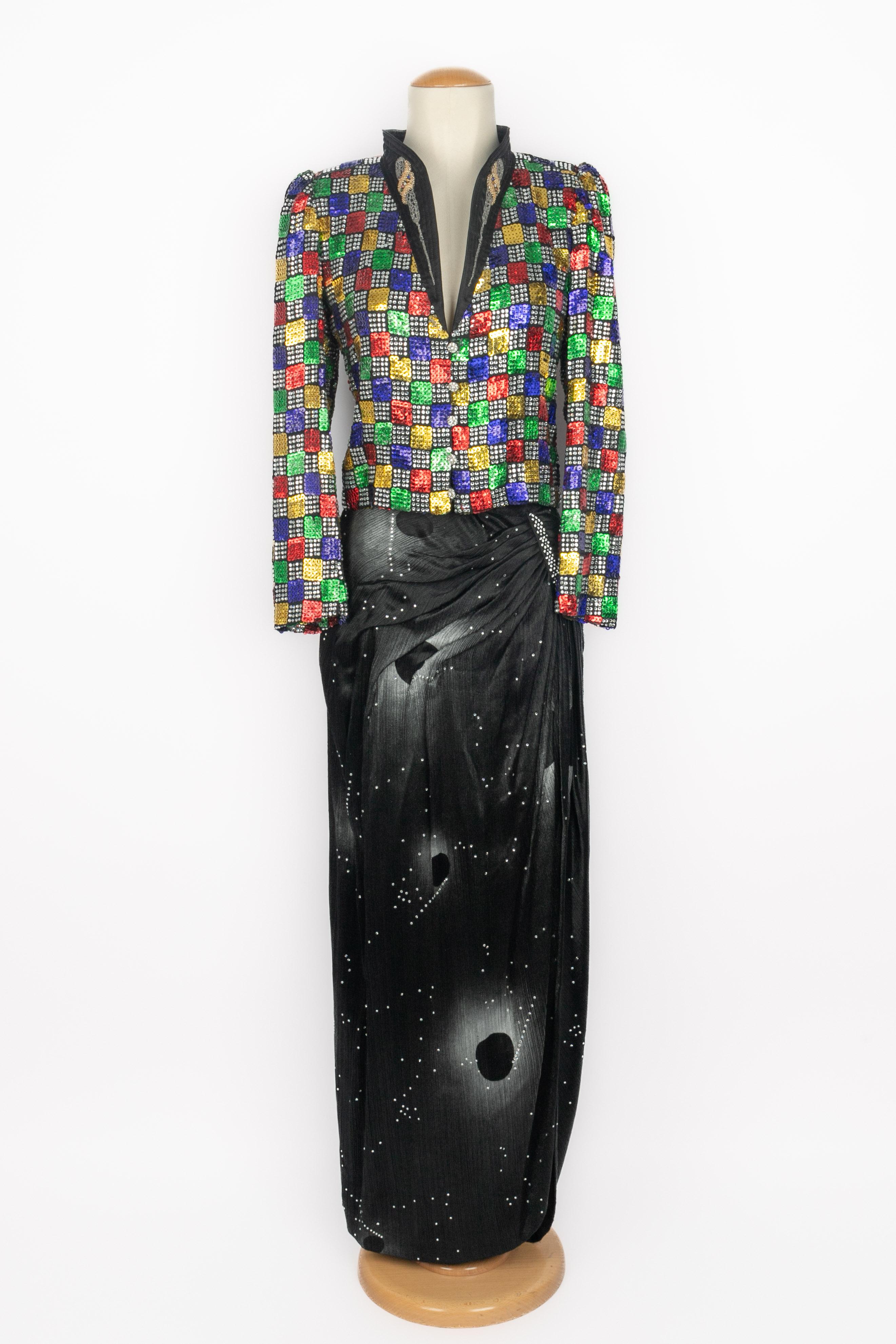 UNGARO - (Made in France) Multicolored sequined evening set composed of a bombers-shaped top entirely embroidered with multicolored pearls and sequins, and a long silk skirt with shirrings. No size nor composition labels, it fits a 36. A Haute