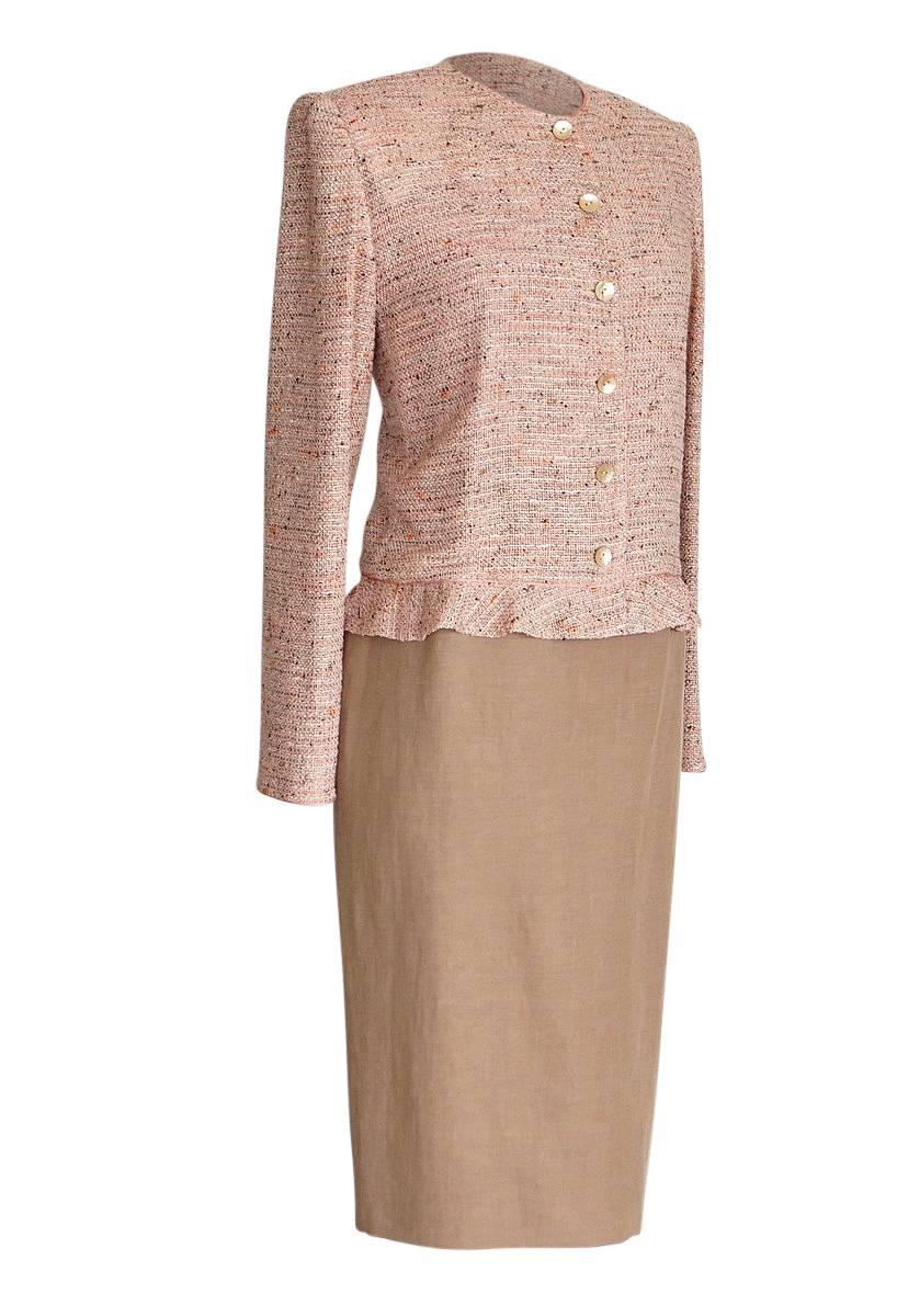 Guaranteed authentic Emanuel Ungaro fantasy tweed jacket and solid skirt suit.  
Easy fit to the single breast jacket with a 2