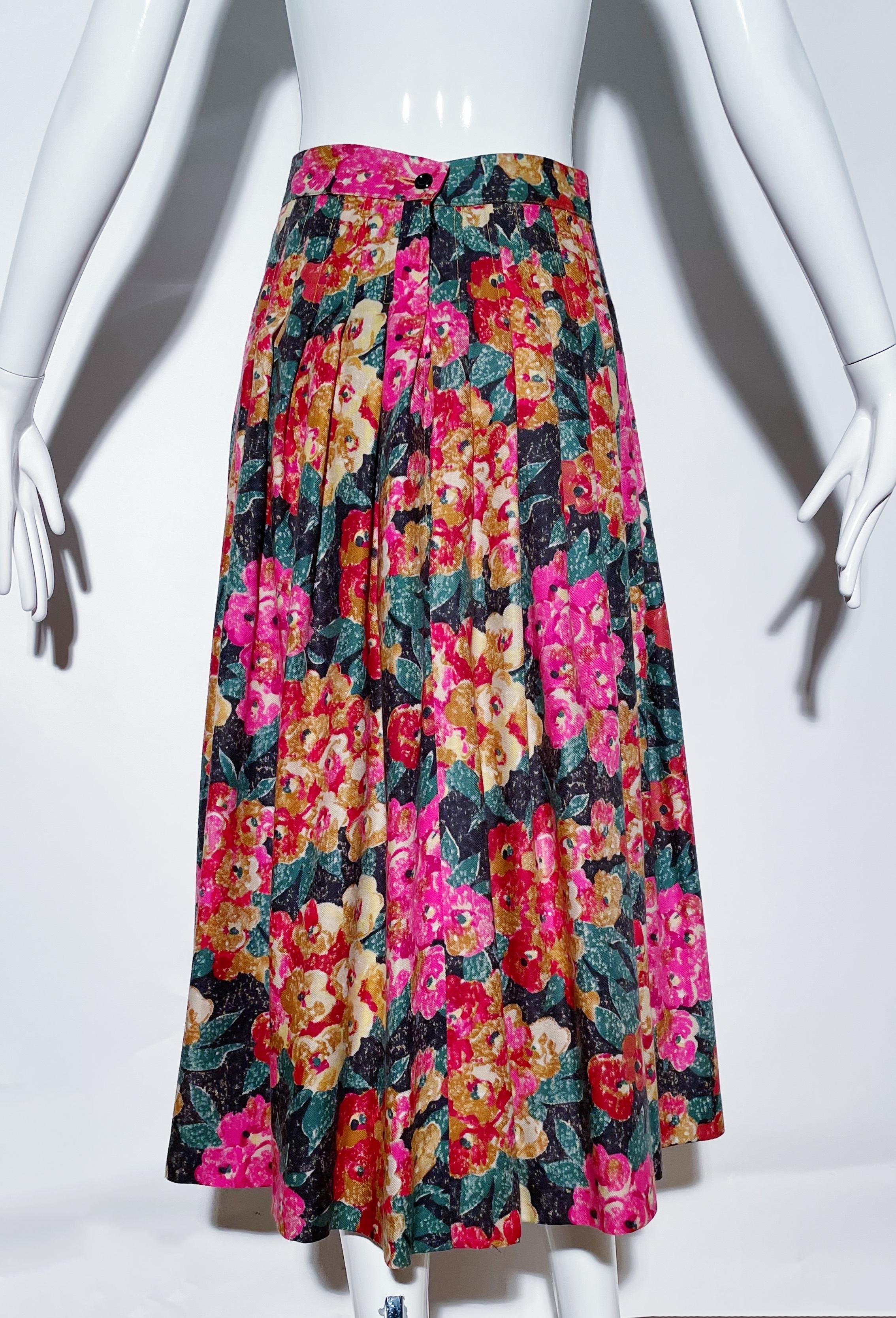 Pink toned floral skirt. Pleated. Rear zipper closure. Made in Italy. 
*Condition: Excellent vintage condition. No visible flaws.

Measurements Taken Laying Flat (inches)—
Waist: 28 in.
Hip: 40 in.
Length: 32 in.
Marked size: 12 US, best fit for an
