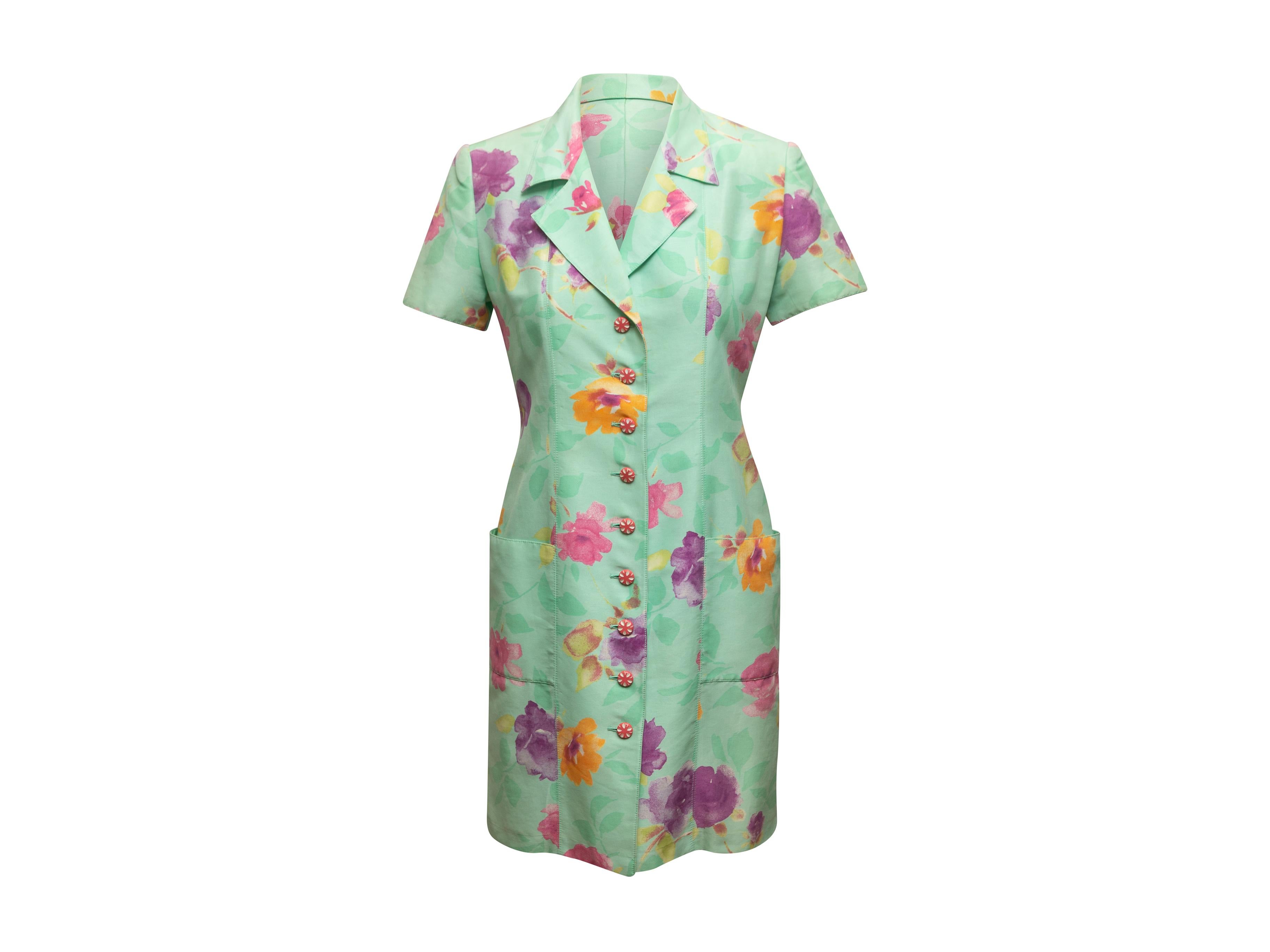 Product details: Vintage mint and multicolor floral print dress by Emanuel Ungaro. Notched collar. Short sleeves. Dual hip pockets. Button closures at center front. 36