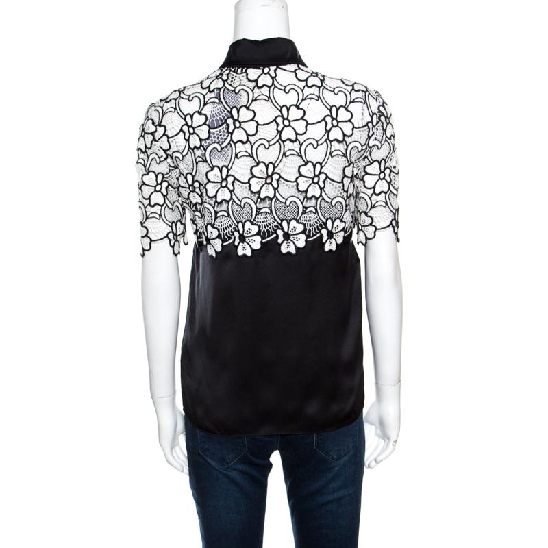 What a wonderful sight! This Emanuel Ungaro blouse just brings joy to one's eyes. It is made from quality fabrics and it flaunts a floral lace bodice with cutouts. You may pair it with skirts and trousers as well.

Includes: Packaging, Original Tag
