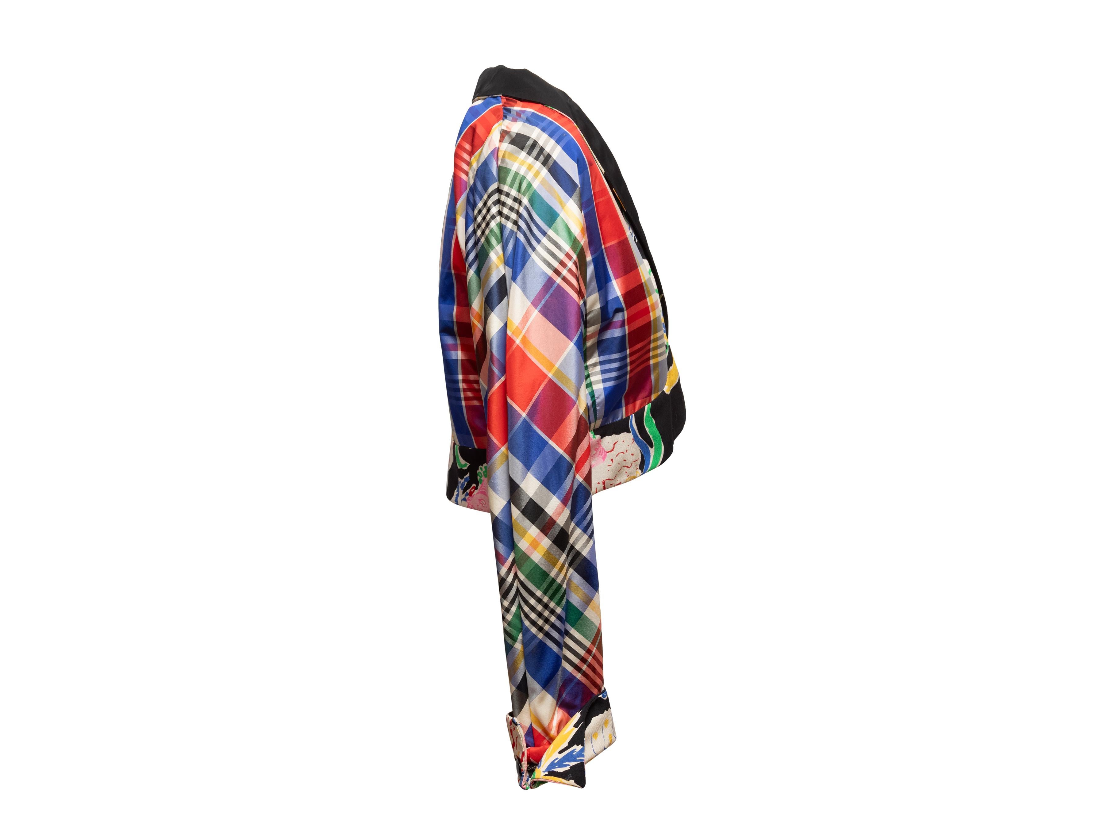 Product Details: Multicolor plaid print jacket by Emanuel Ungaro Parallele. Floral print trim throughout. Shawl collar. Hook-and-eye closures at center front. 23