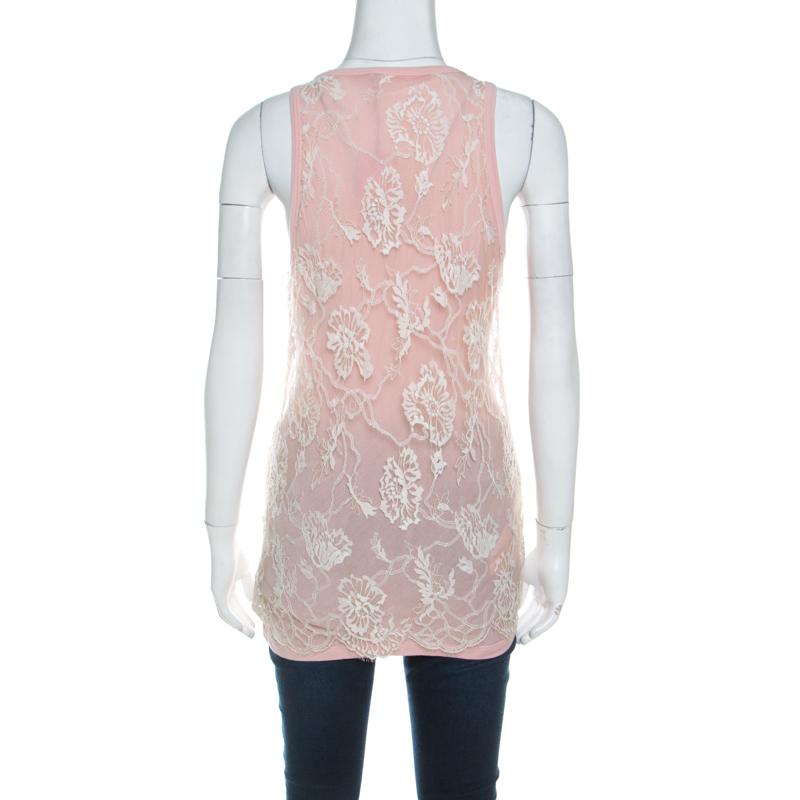Renowned for its trendsetting designs, this Emanuel Ungaro creation is a must-have in your collection. A pink piece like this can be paired with contrasting bottoms to complete your look. It is tailored in a cotton blend into a fabulous silhouette