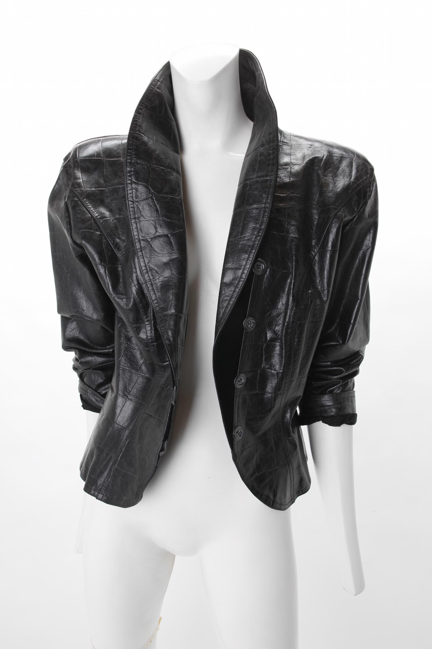 Emanuel Ungaro Parallele Paris Crocodile Embossed Leather Jacket, c. 1980s.
Emanuel Ungaro Parallele Paris Crocodile Embossed Leather Jacket with shoulder pads.
Jacket features velvet lined pointed collar designed to be worn either up or down.
Four